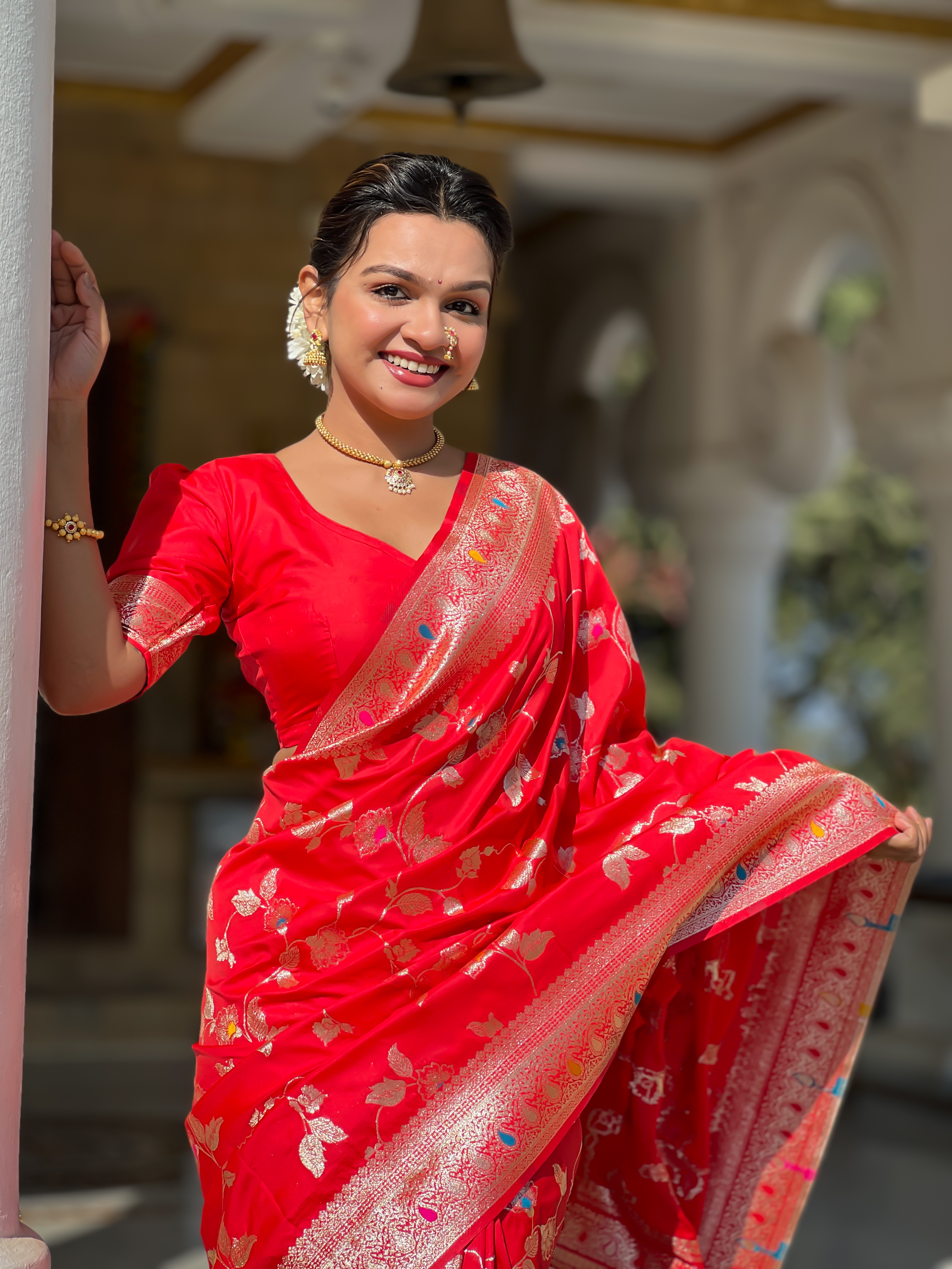 Make a bold and elegant statement with this striking red Banarasi silk saree