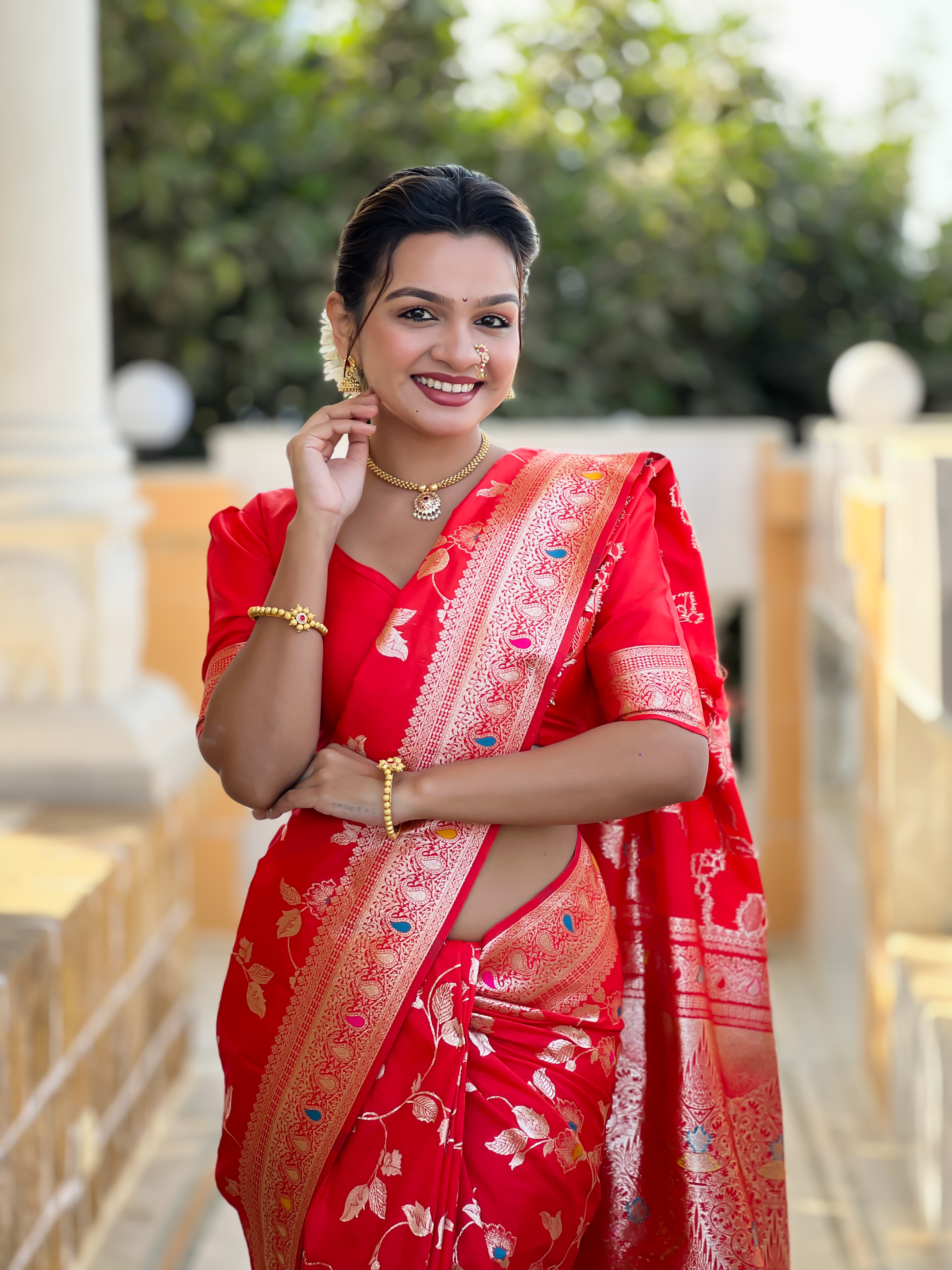 Make a bold and elegant statement with this striking red Banarasi silk saree