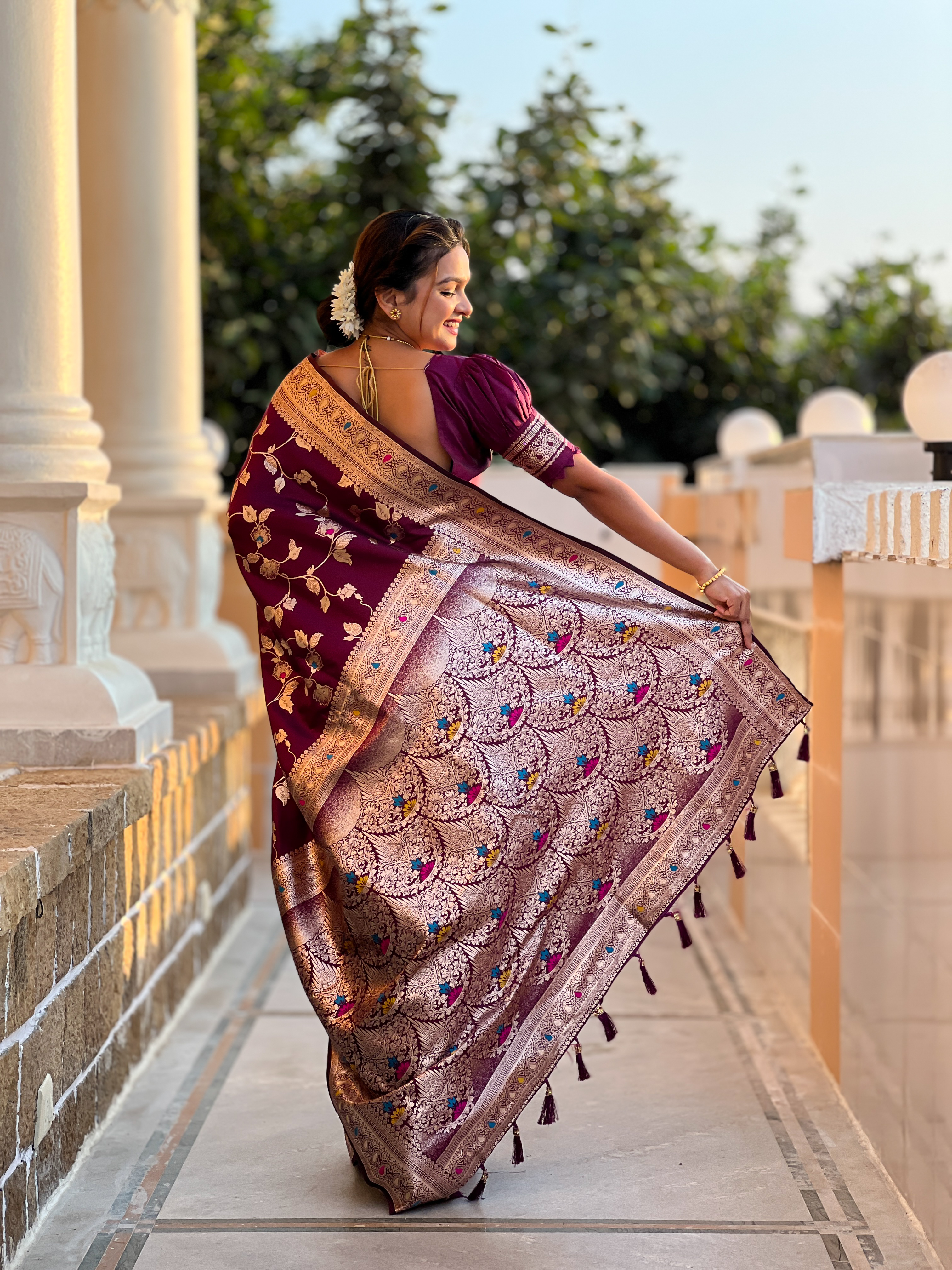 Indulge in the opulence of this wine Banarasi silk saree