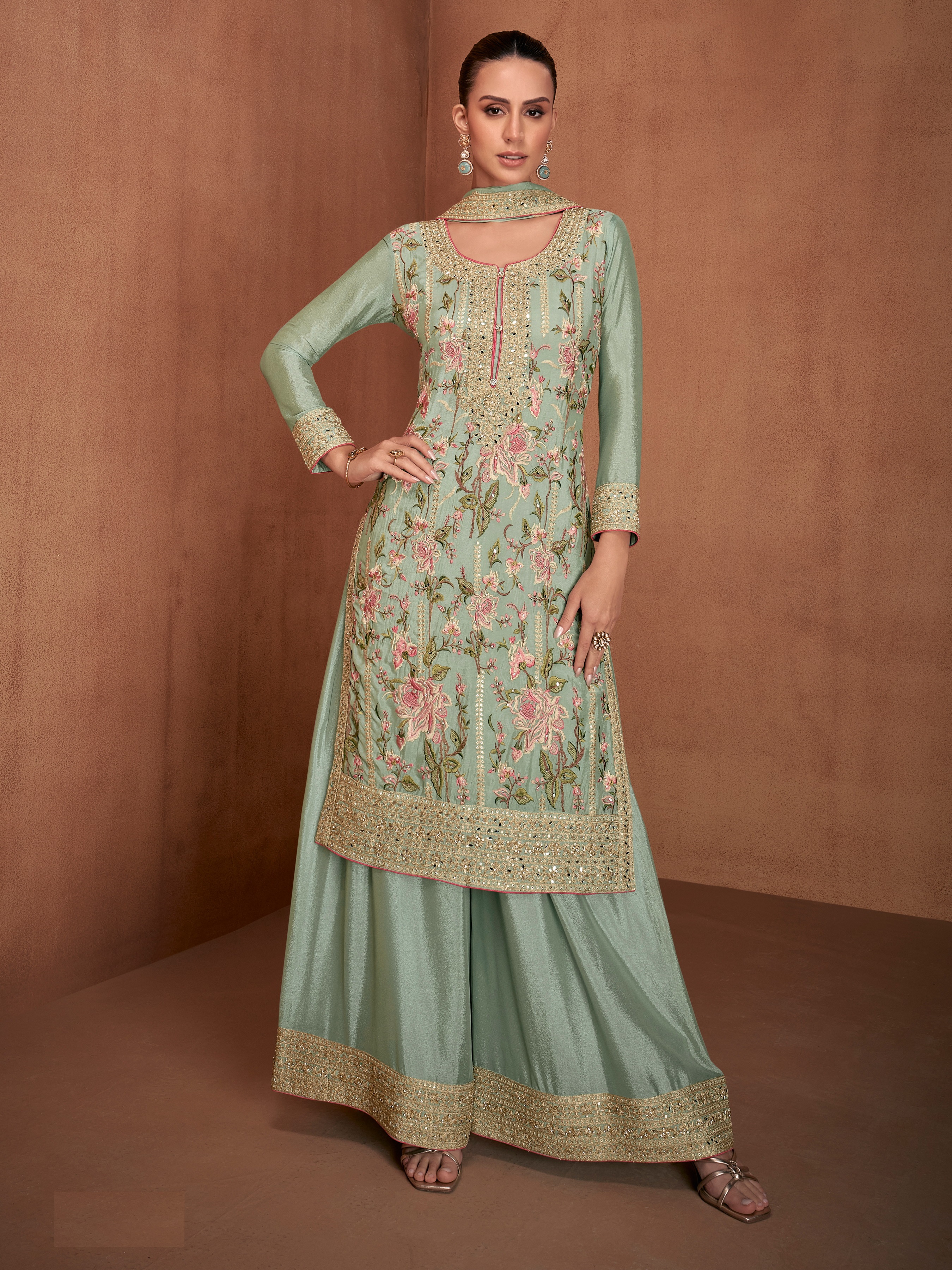 An exquisite selection of Pakistani Salwar Suits in a captivating shade of green.