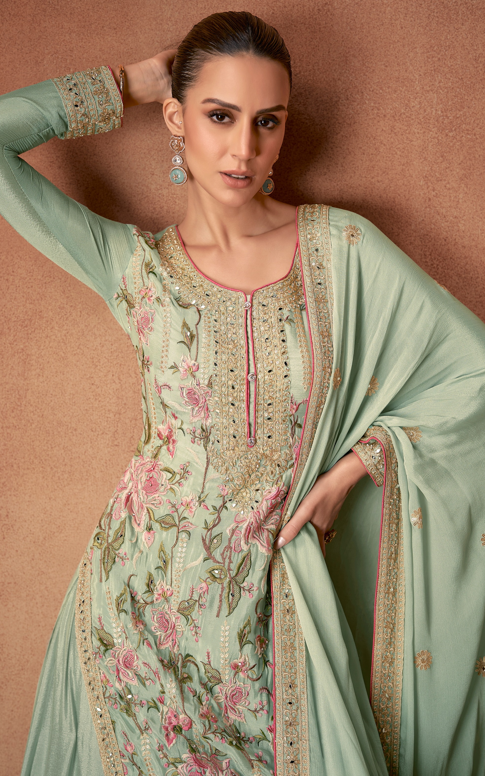 An exquisite selection of Pakistani Salwar Suits in a captivating shade of green.