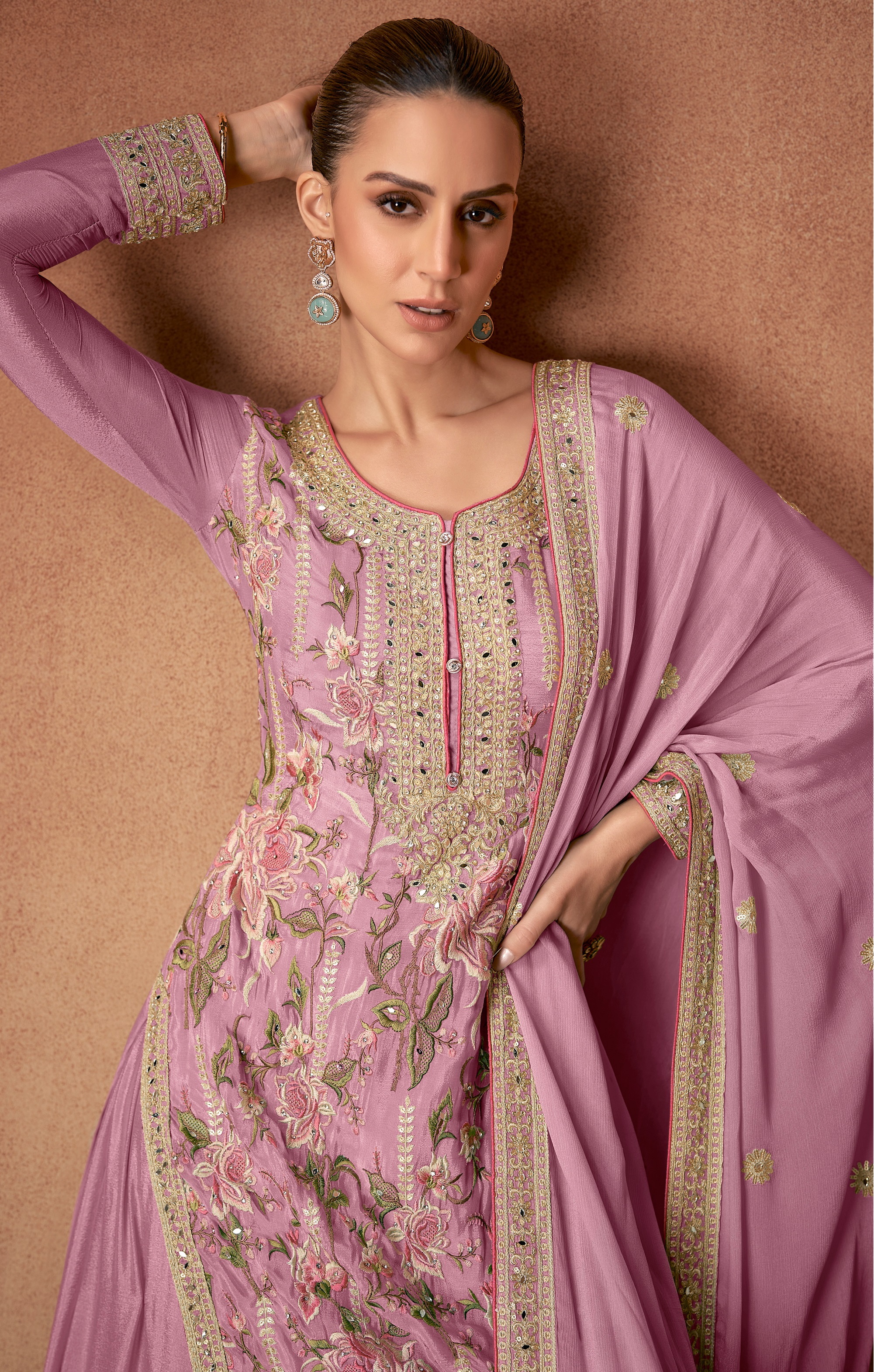 A mesmerising selection of Pakistani Salwar Suits in a delicate shade of pink