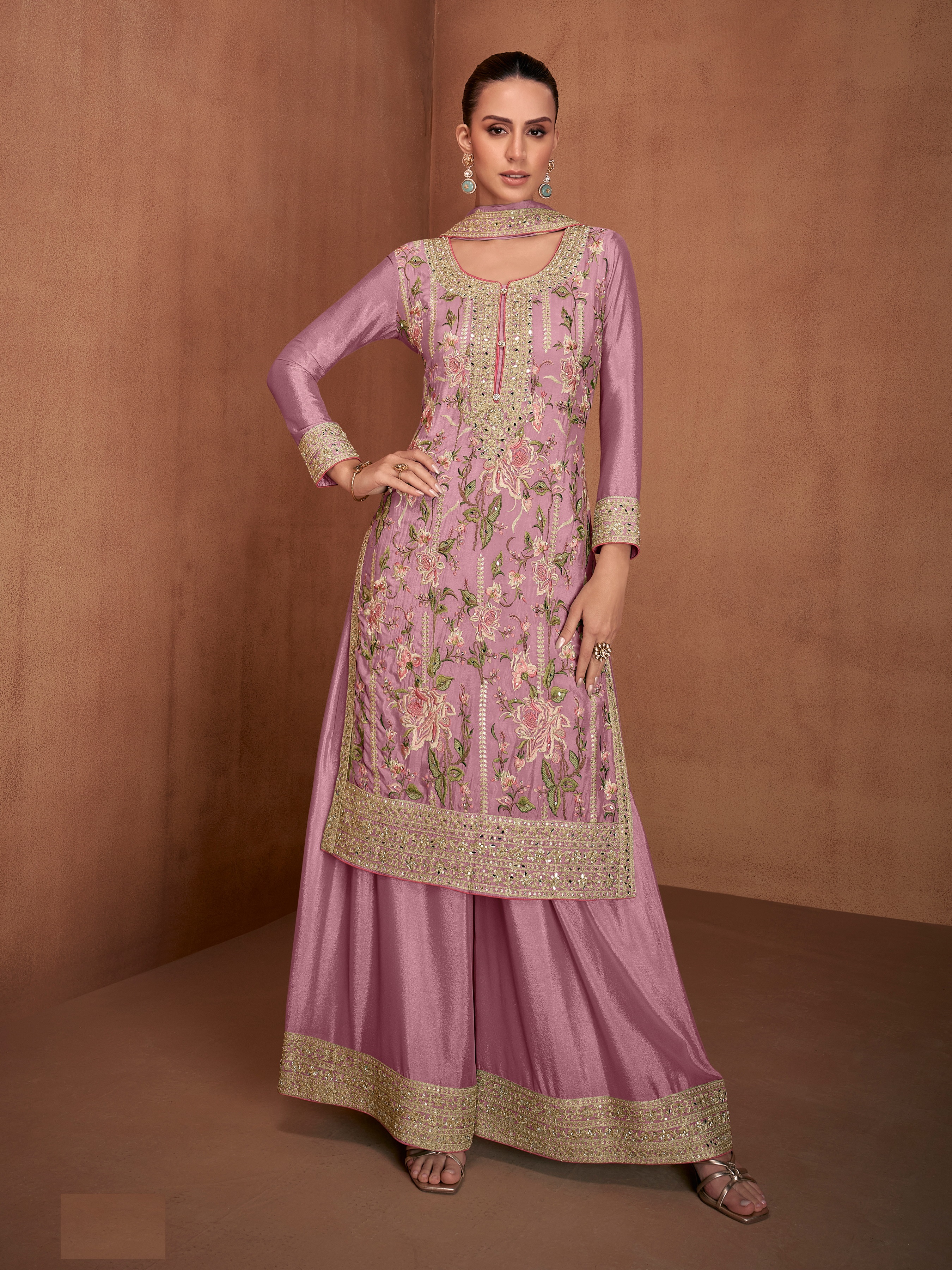 A mesmerising selection of Pakistani Salwar Suits in a delicate shade of pink