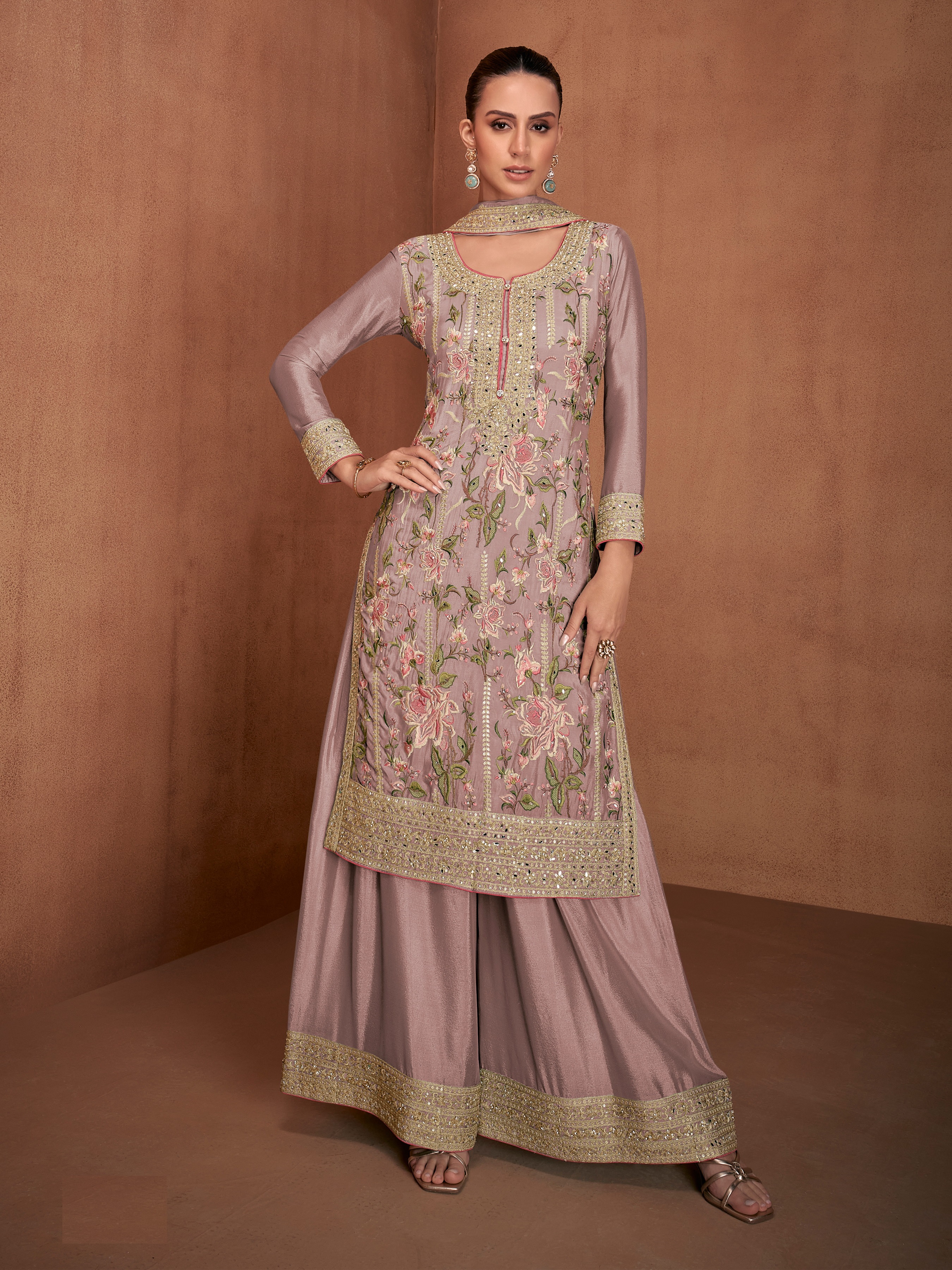 A sophisticated selection of Pakistani Salwar Suits in a stunning mauve hue