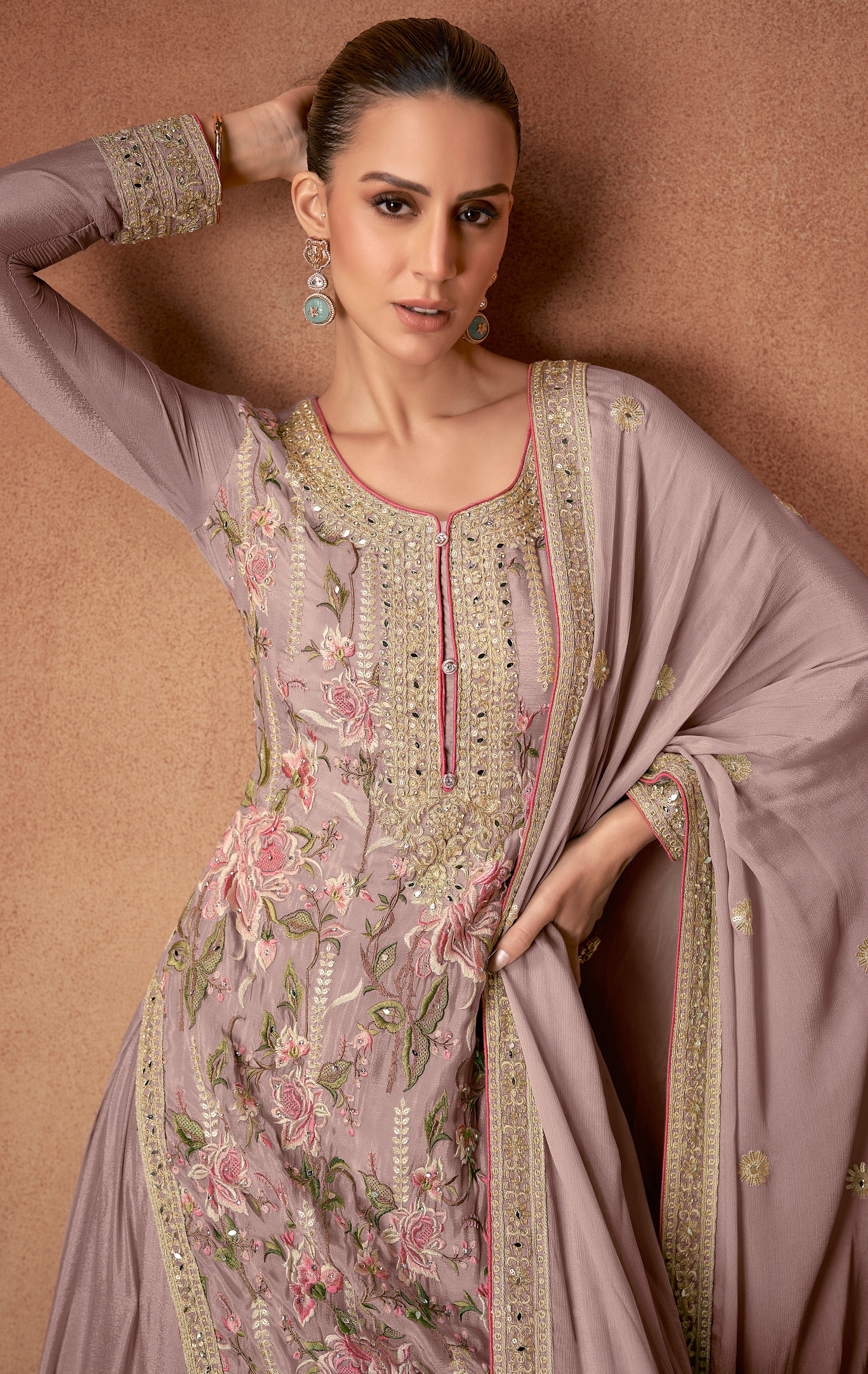 A sophisticated selection of Pakistani Salwar Suits in a stunning mauve hue