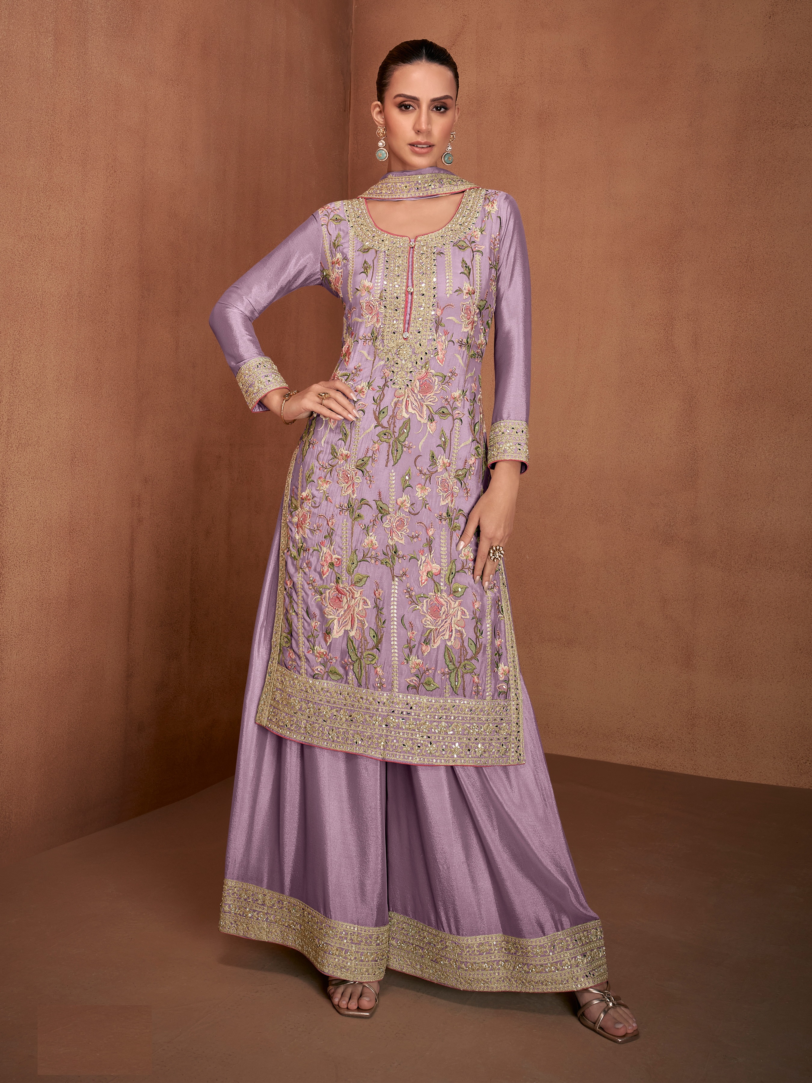 A regal selection of Pakistani Salwar Suits in a captivating purple hue.