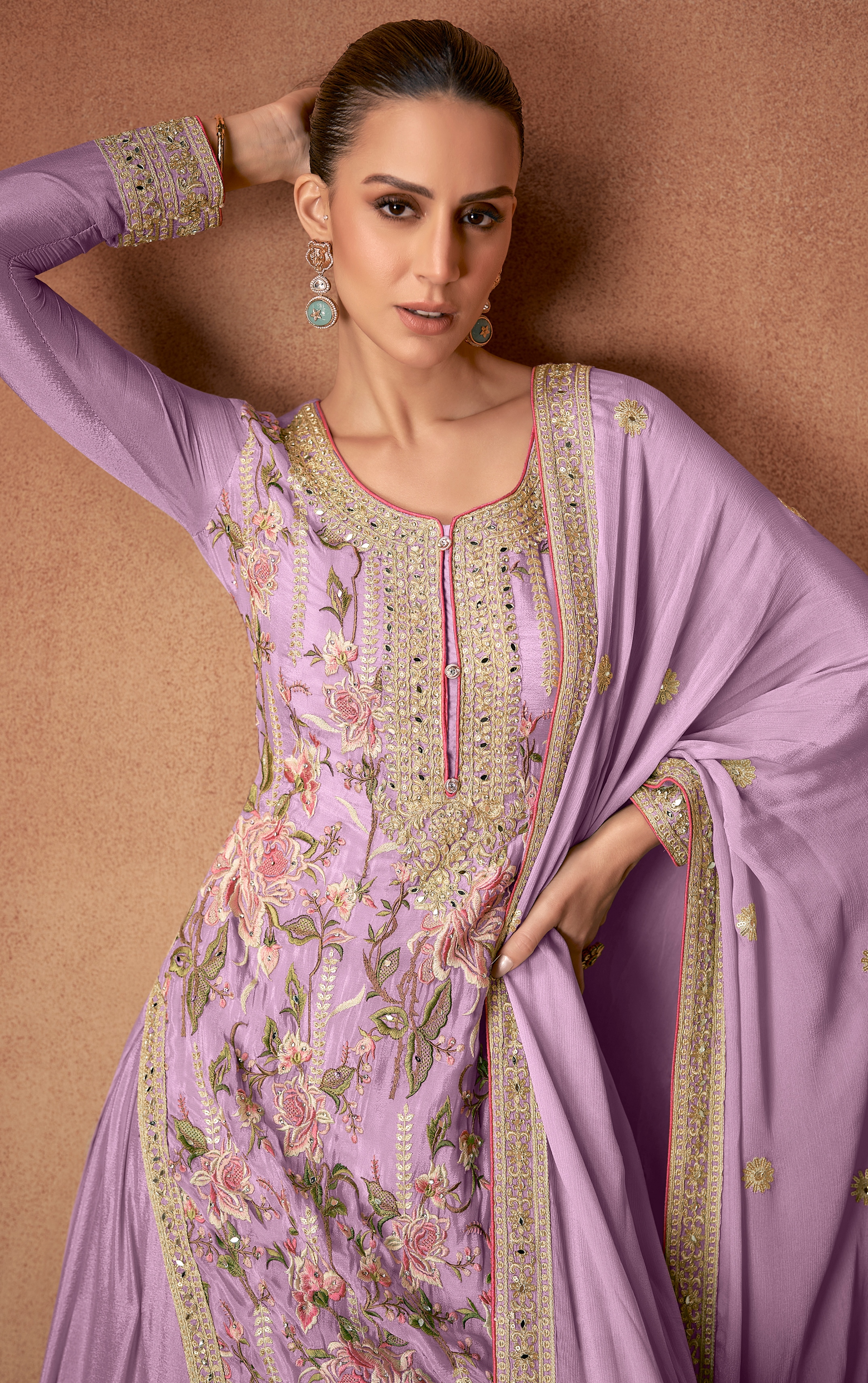 A regal selection of Pakistani Salwar Suits in a captivating purple hue.