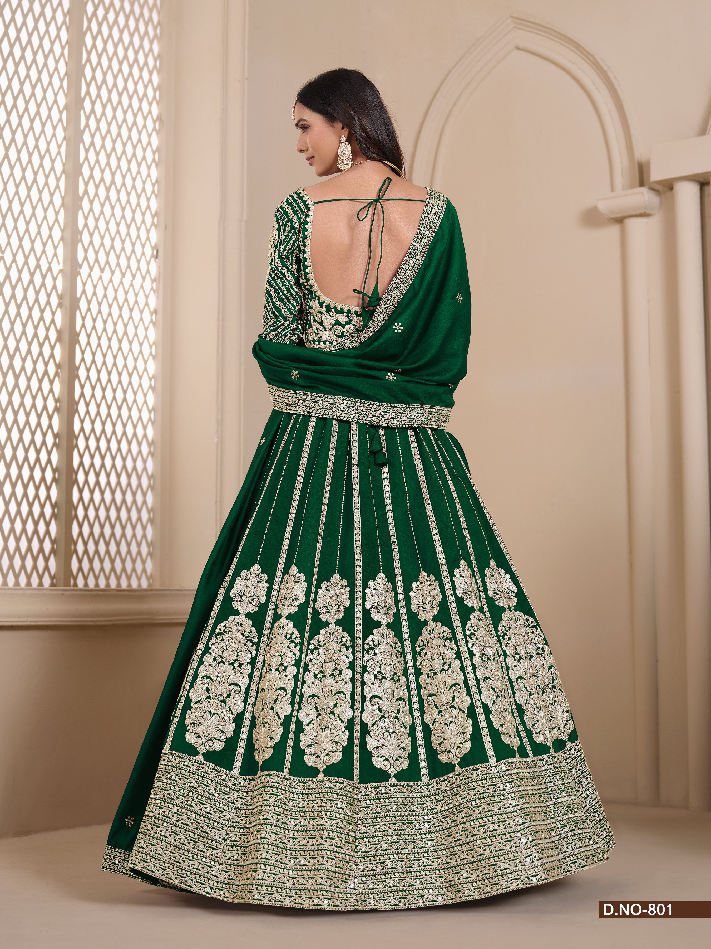 This exquisite green shimmer art silk umbrella lehenga is a true masterpiece