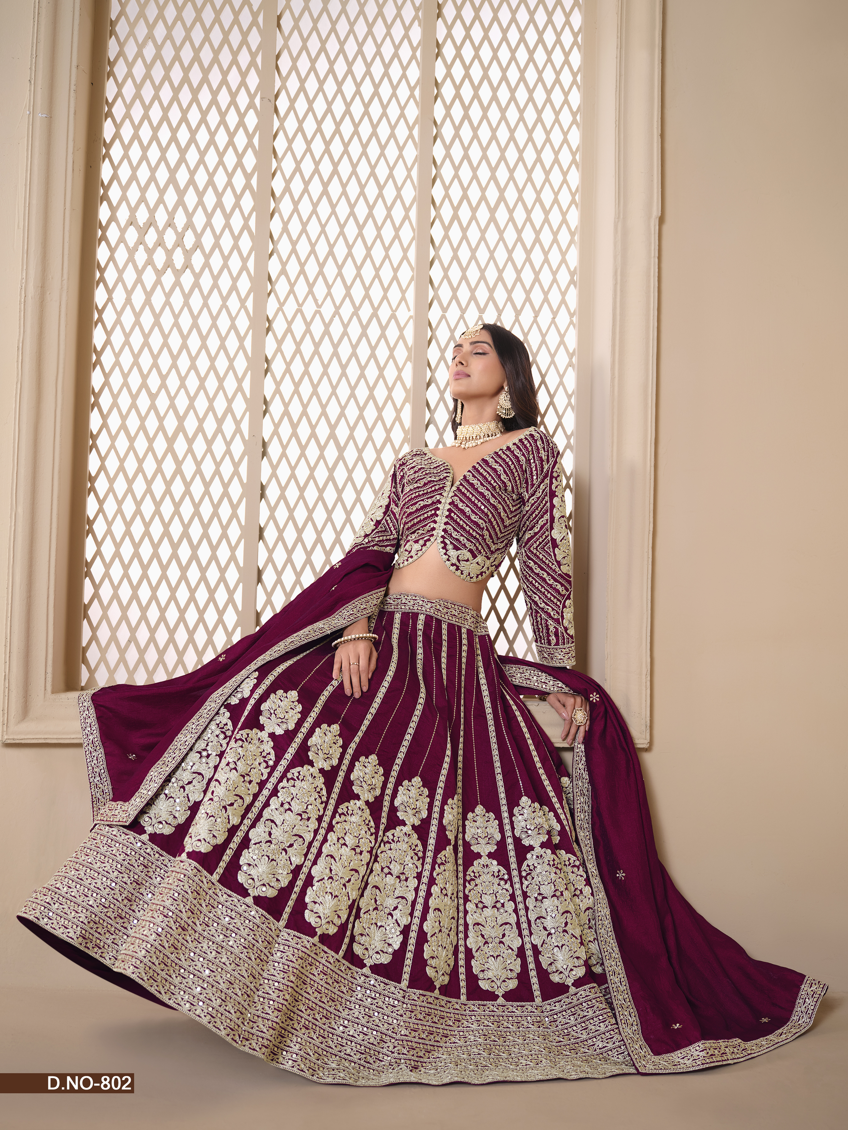 This exquisite wine shimmer art silk umbrella lehenga