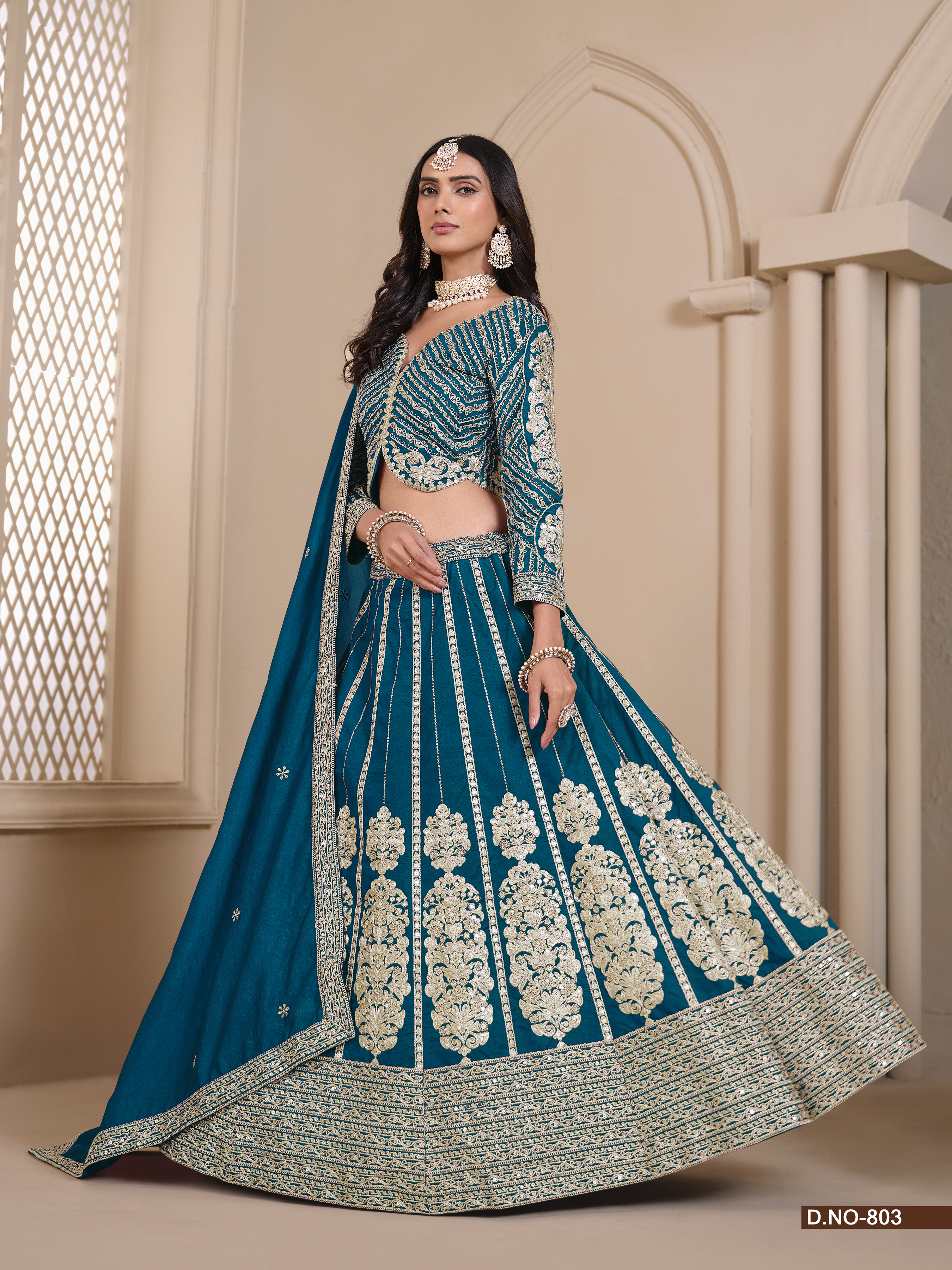 Step into elegance with this mesmerizing blue shimmer art silk umbrella lehenga