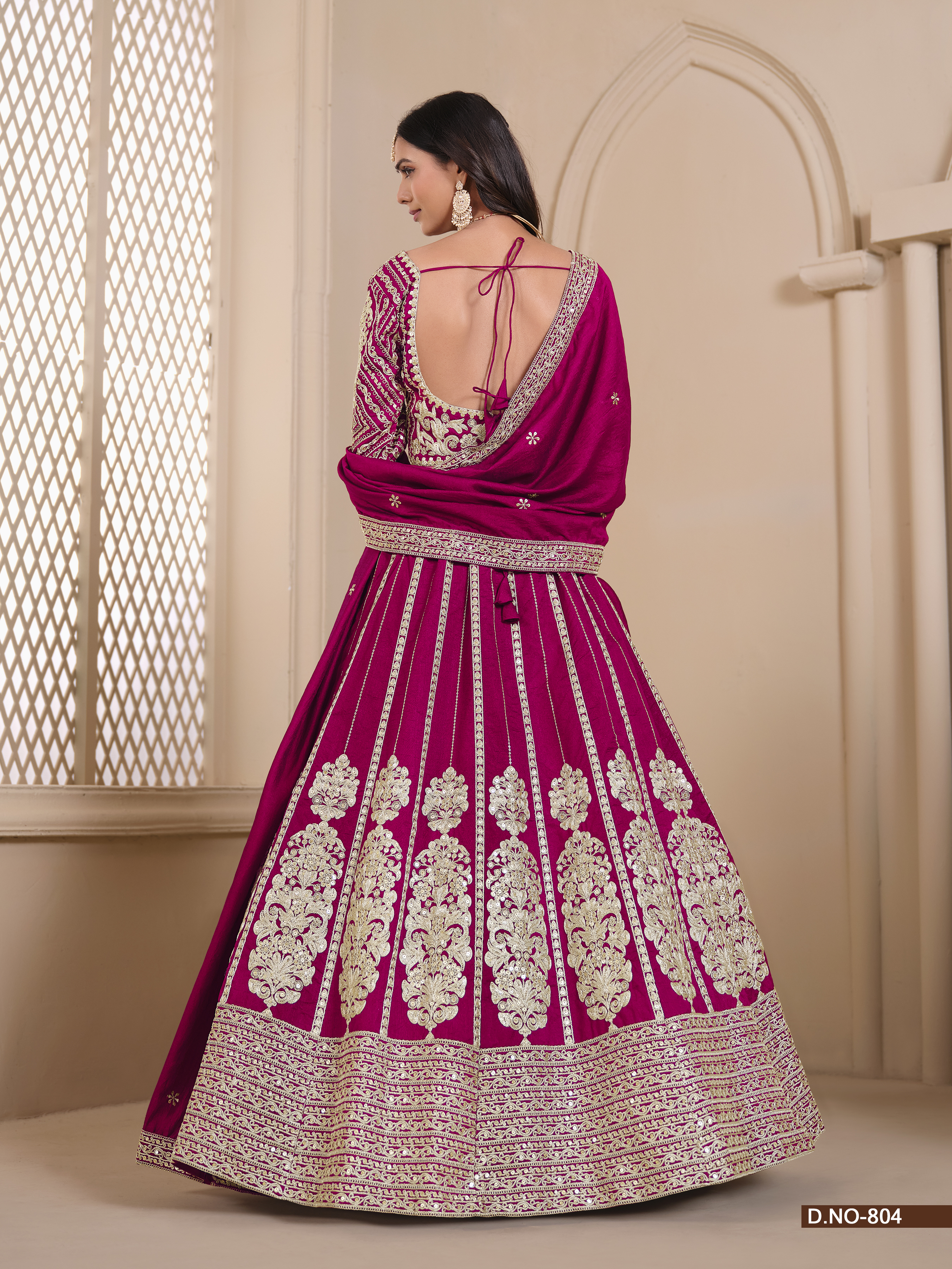 Radiate charm and elegance in this breathtaking pink shimmer art silk umbrella lehenga