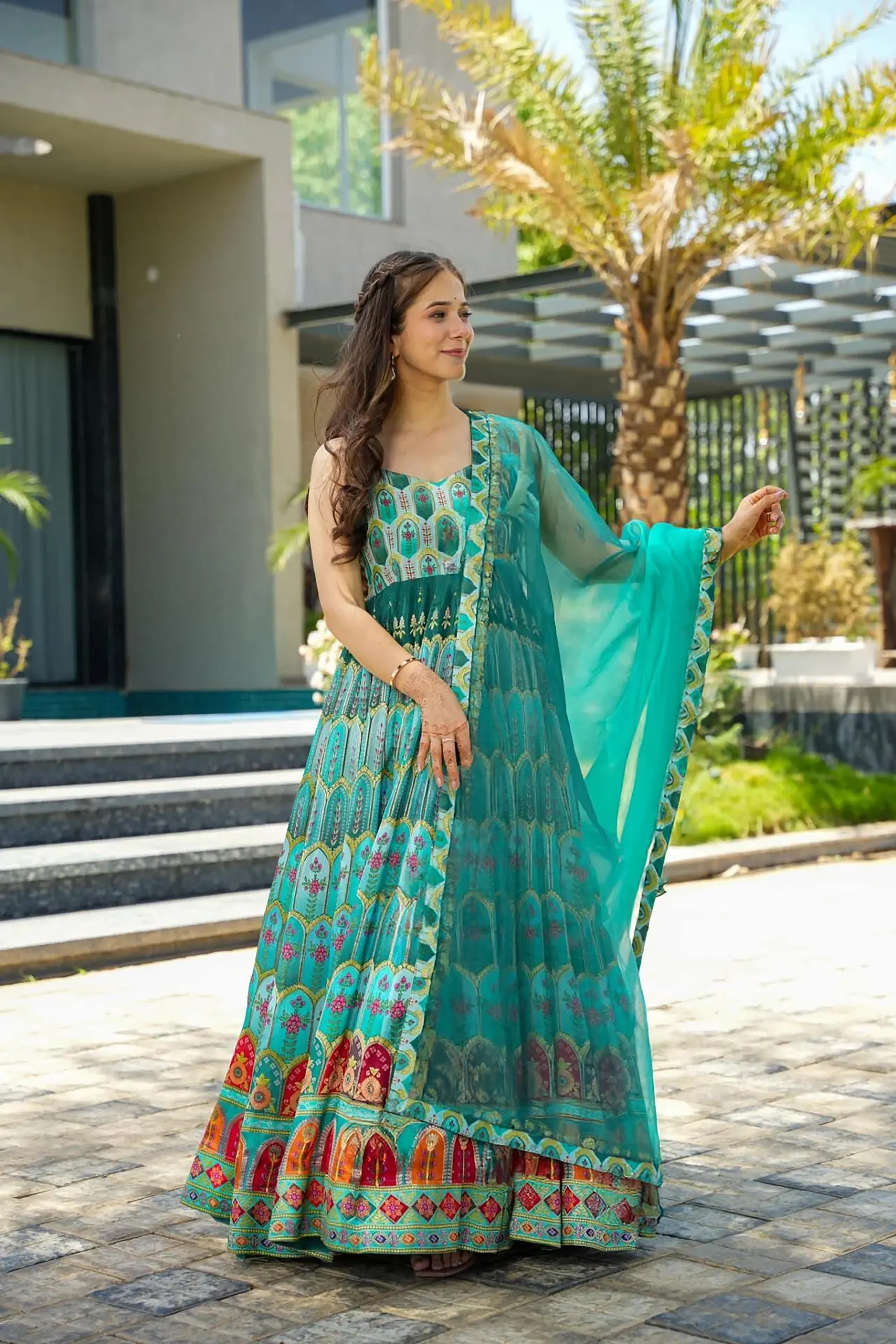 Step into elegance with this stunning green readymade long gown