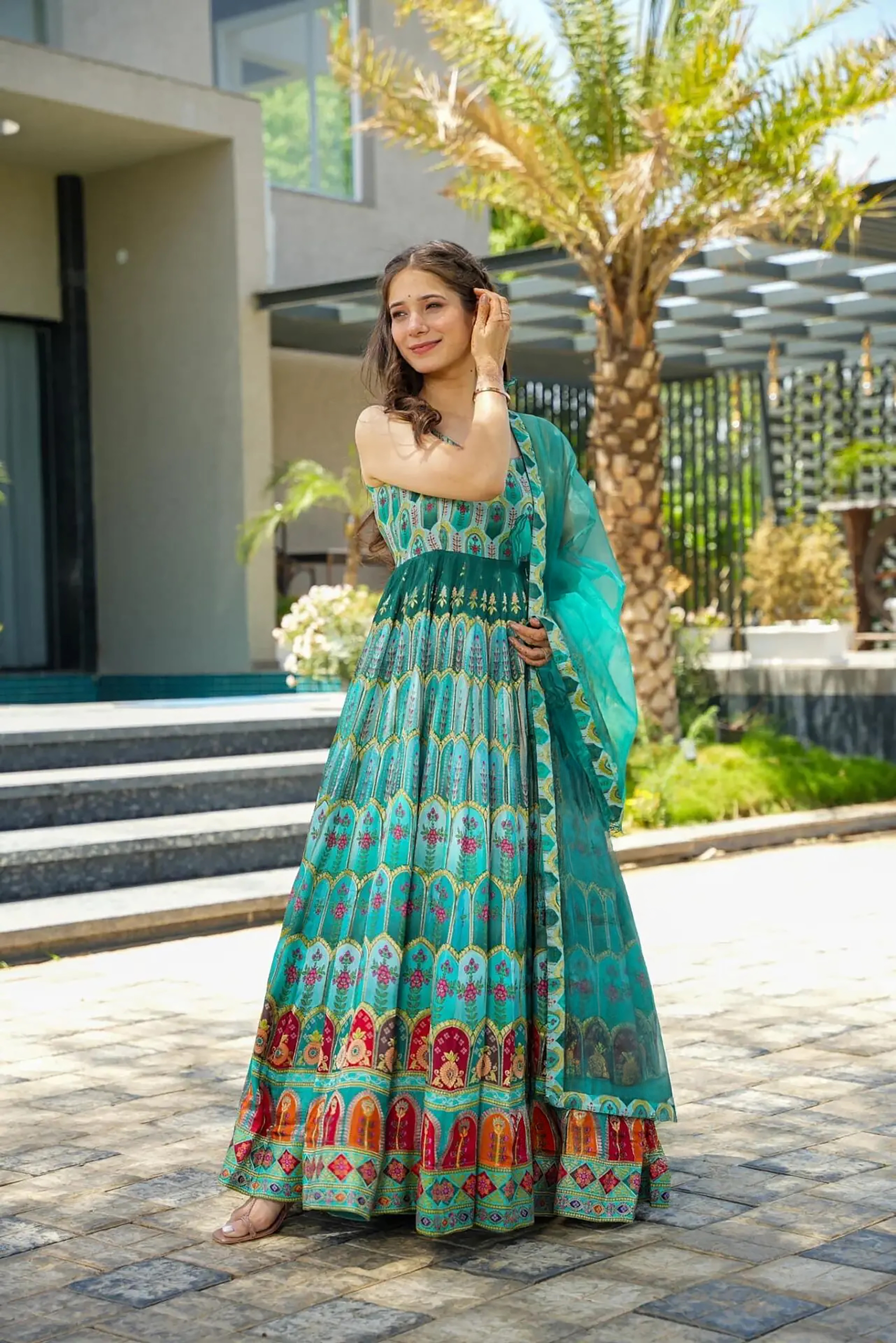 Step into elegance with this stunning green readymade long gown