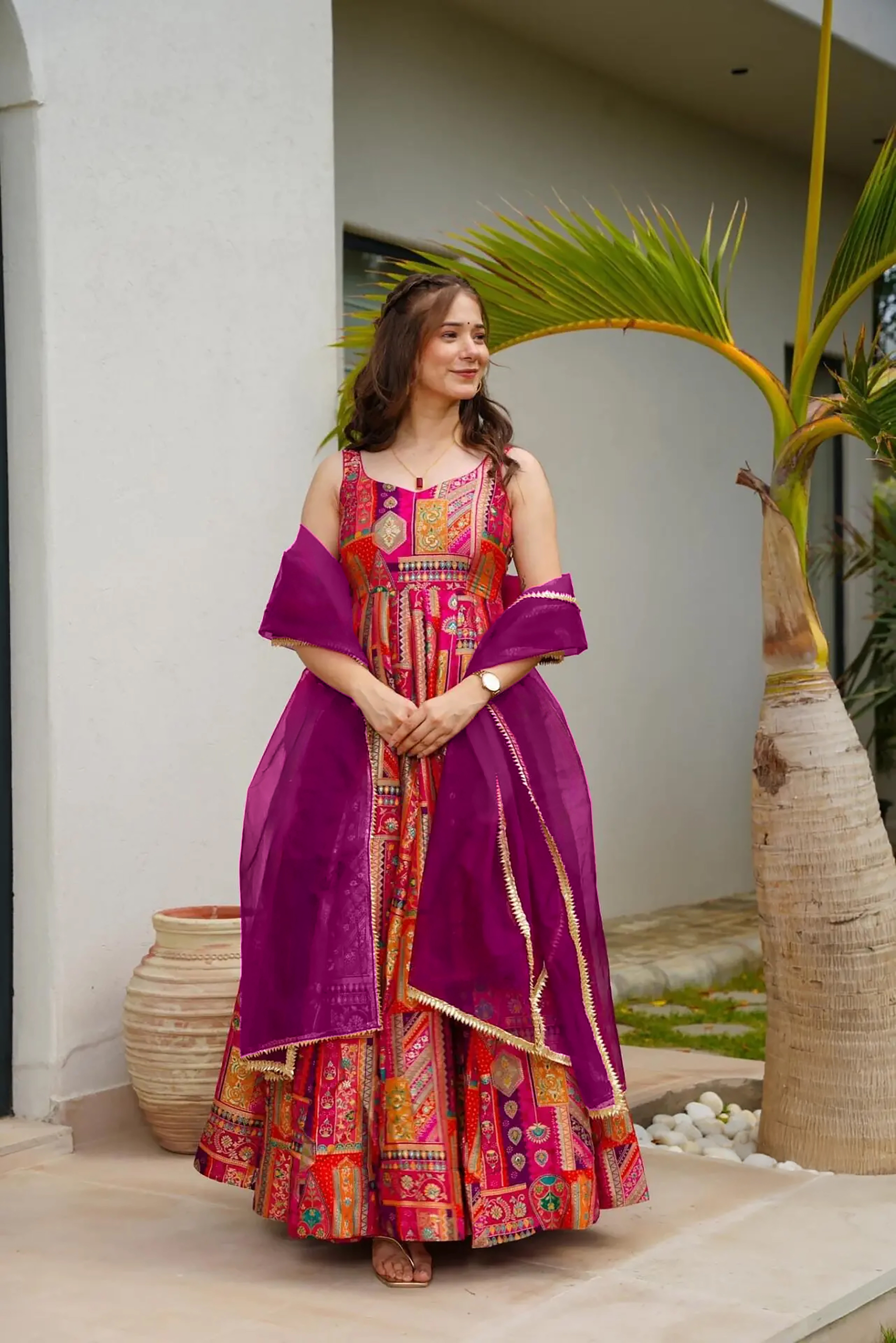 Make a bold statement with this vibrant pink readymade long gown