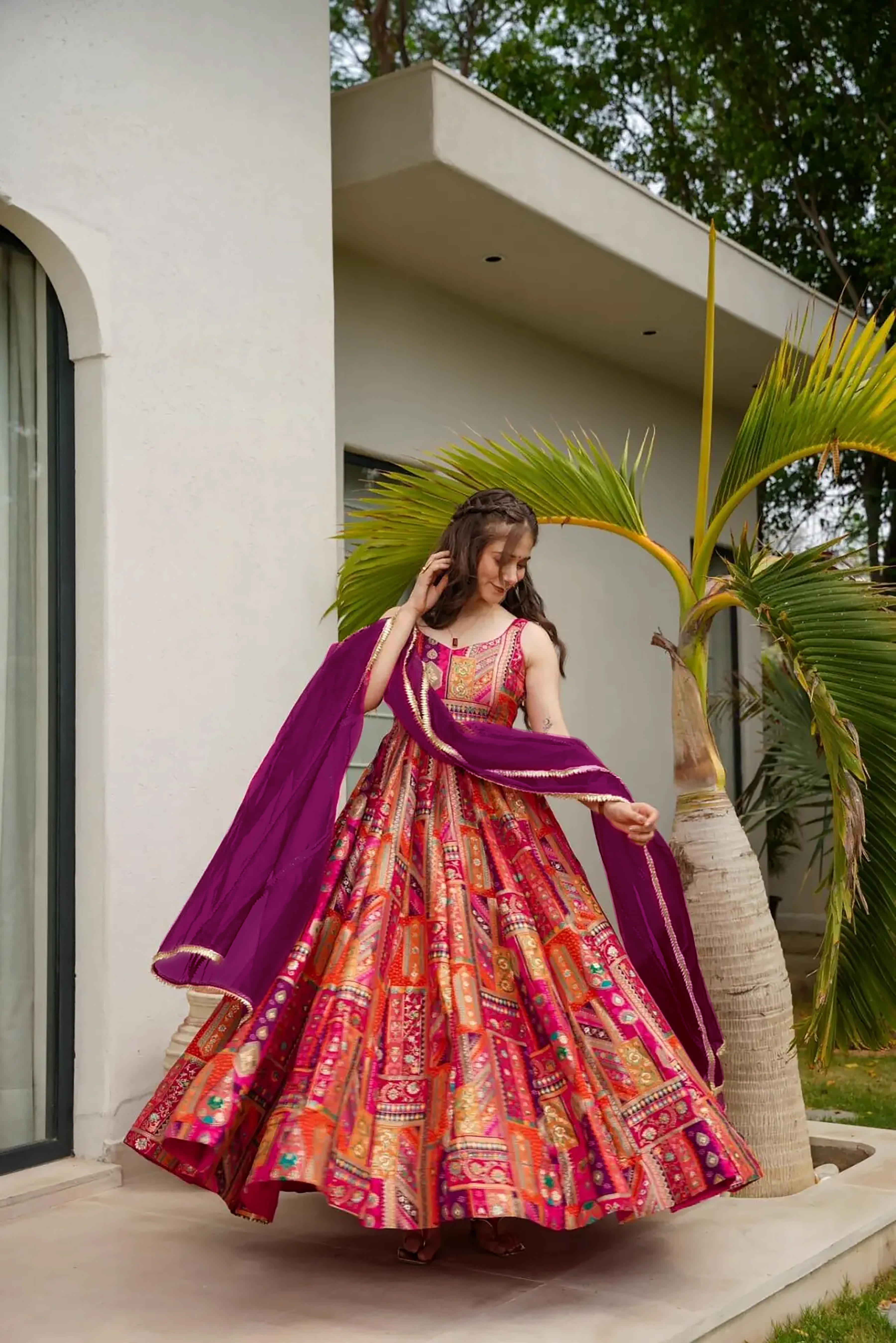 Make a bold statement with this vibrant pink readymade long gown