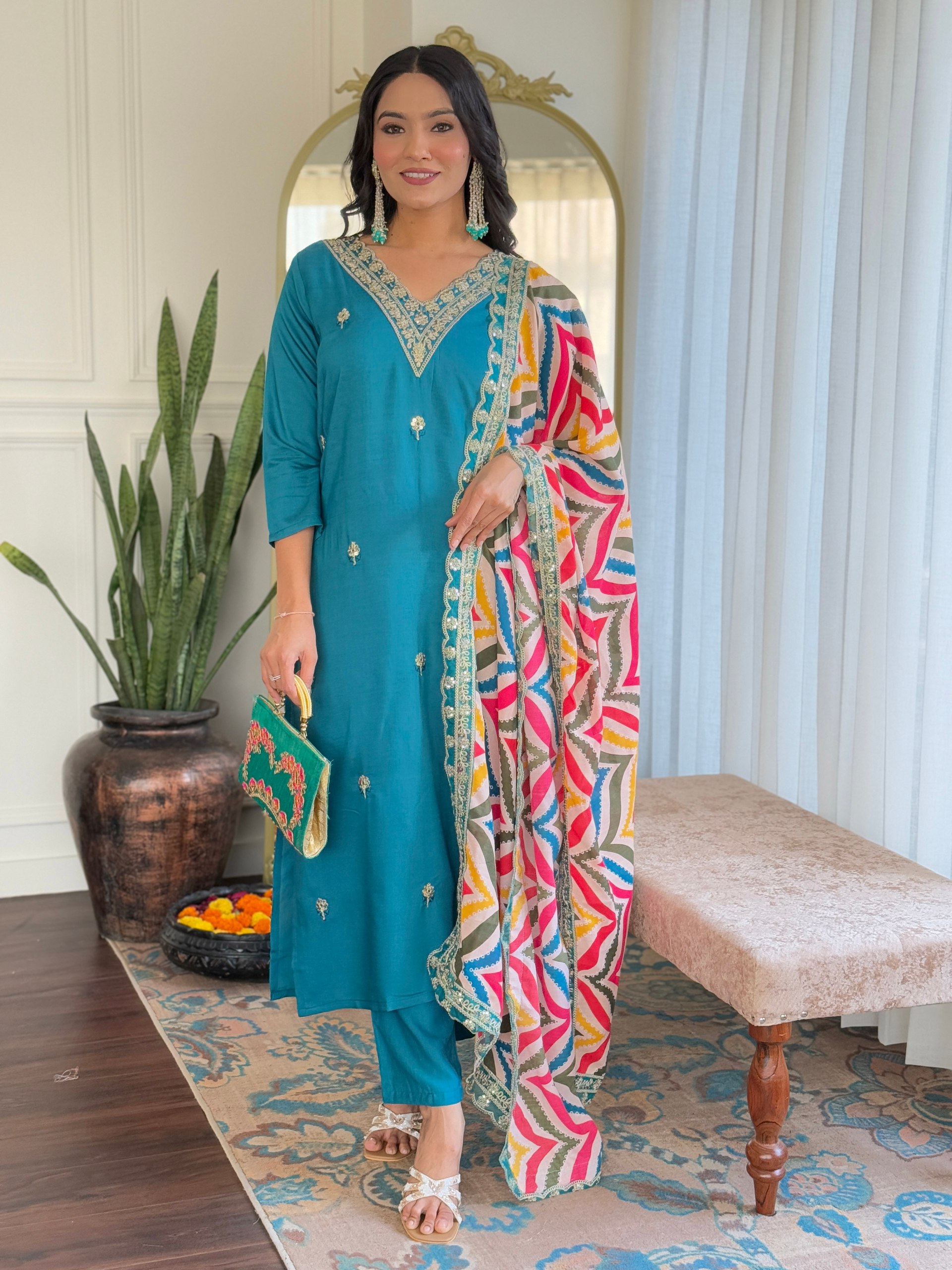 Step into elegance this Eid with this stunning Firozi salwar kameez
