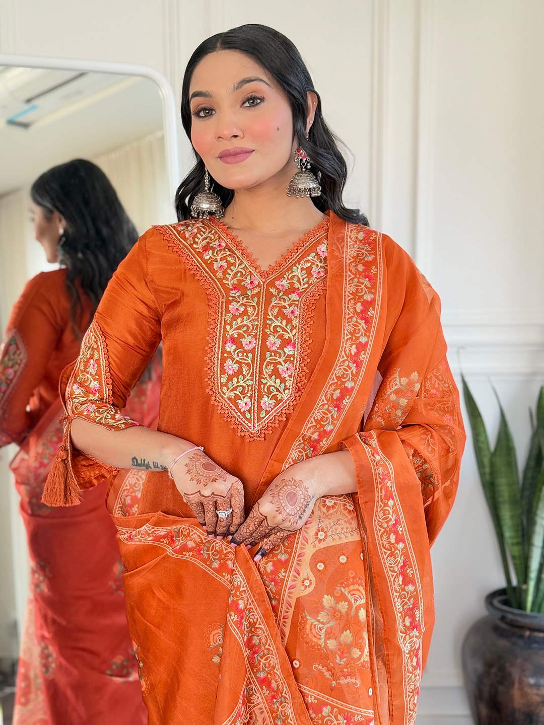 Brighten up your Eid celebrations with this stunning orange salwar kameez