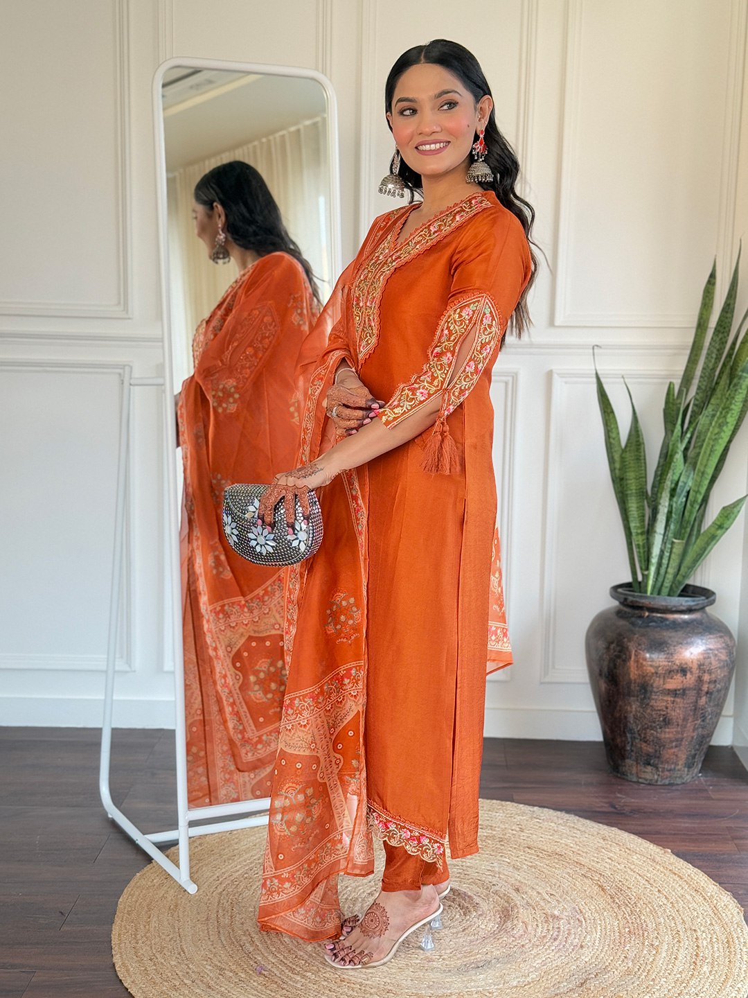 Brighten up your Eid celebrations with this stunning orange salwar kameez