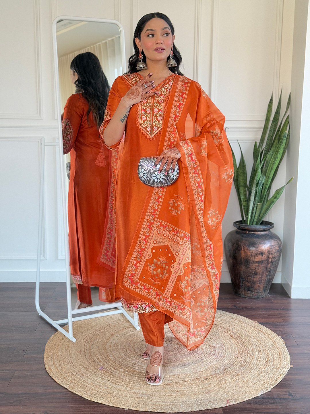 Brighten up your Eid celebrations with this stunning orange salwar kameez