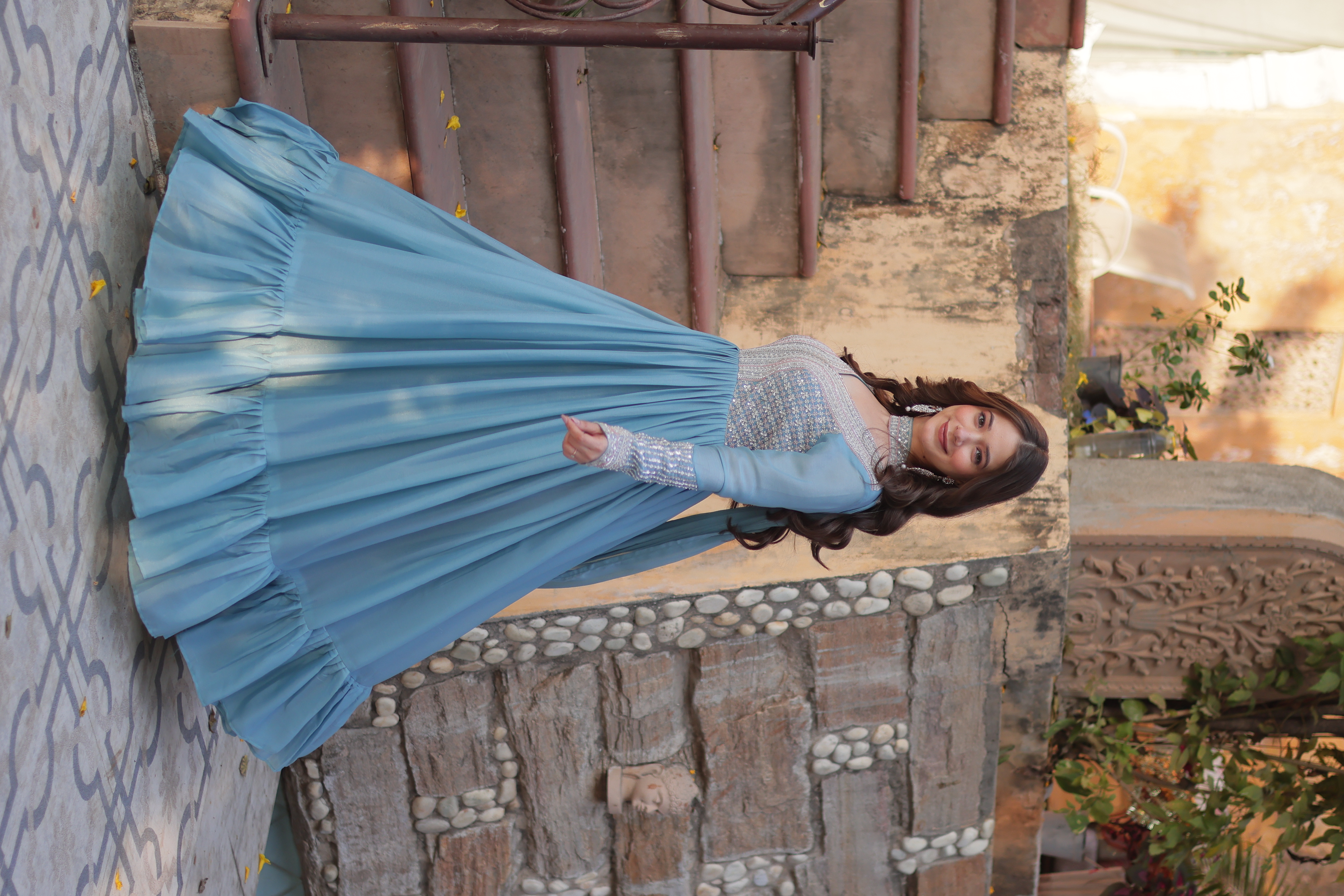 Radiate effortless charm in this sky blue cotton gown