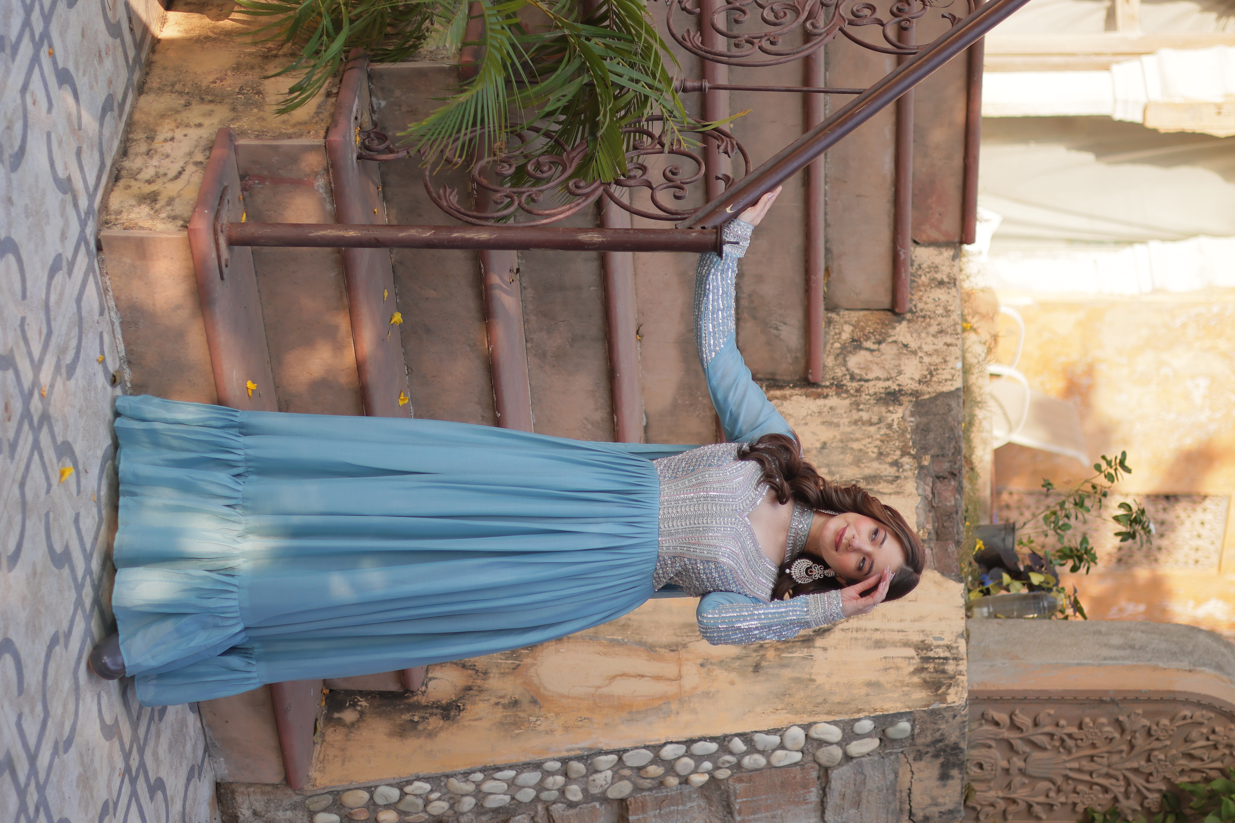 Radiate effortless charm in this sky blue cotton gown