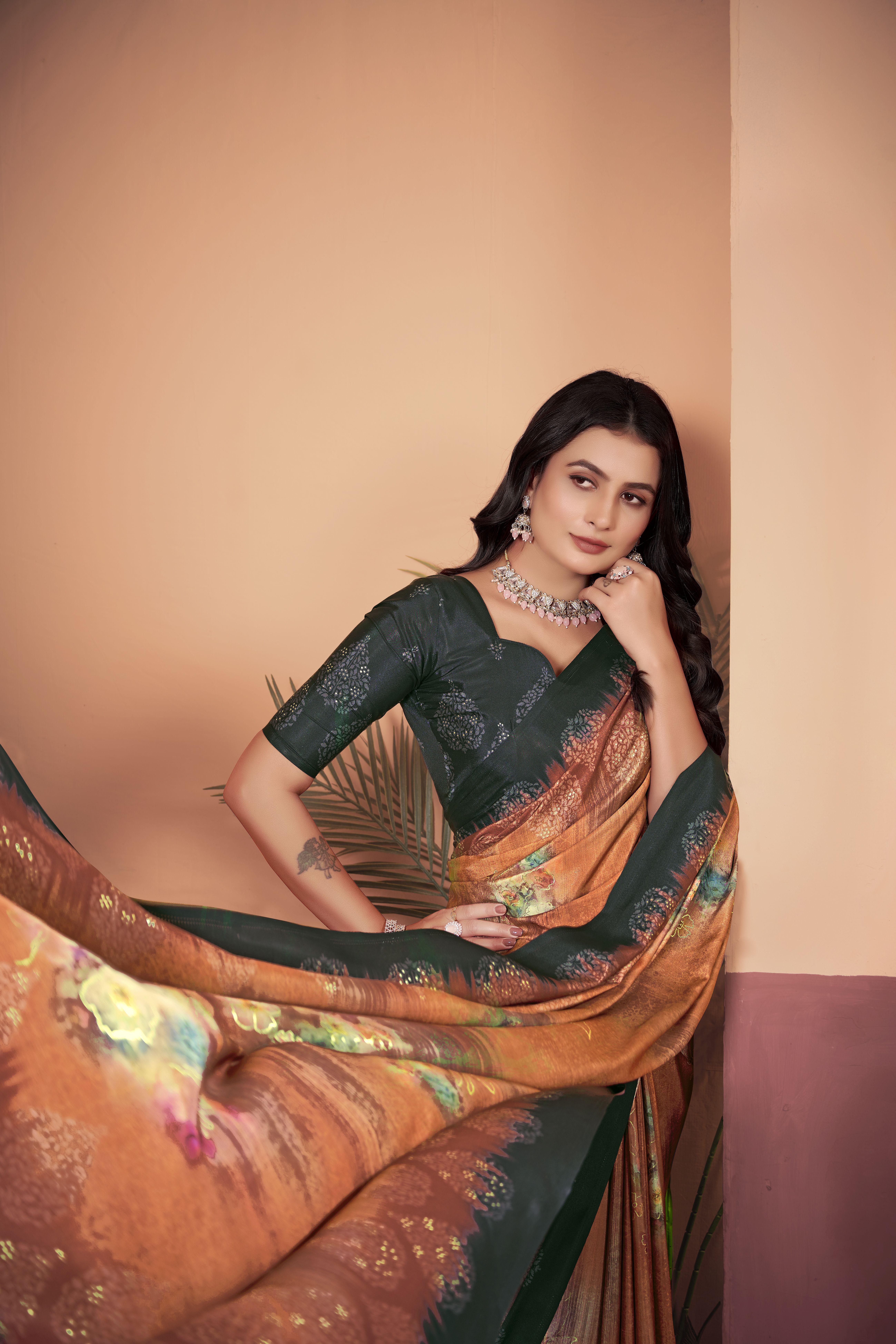 Vibrant Orange Crepe Silk Saree with Contrasting Green Blouse