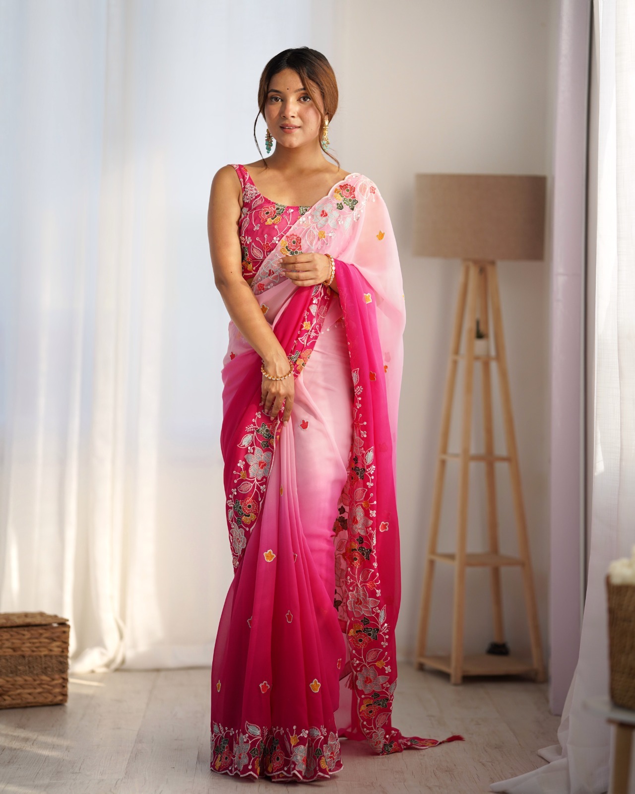 Drape yourself in the beauty of this stunning pink georgette saree