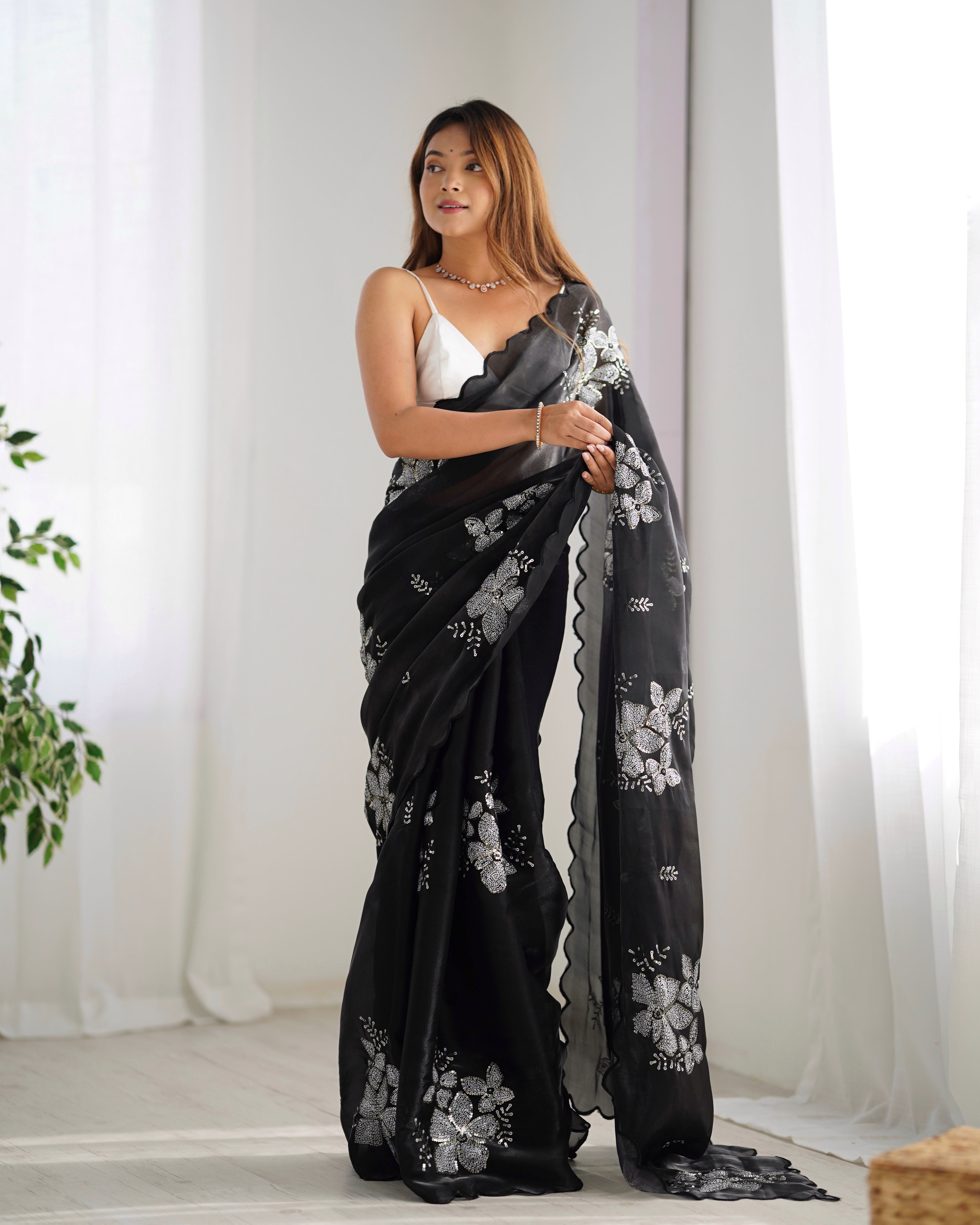 Drape yourself in luxury and sophistication with this exquisite black saree