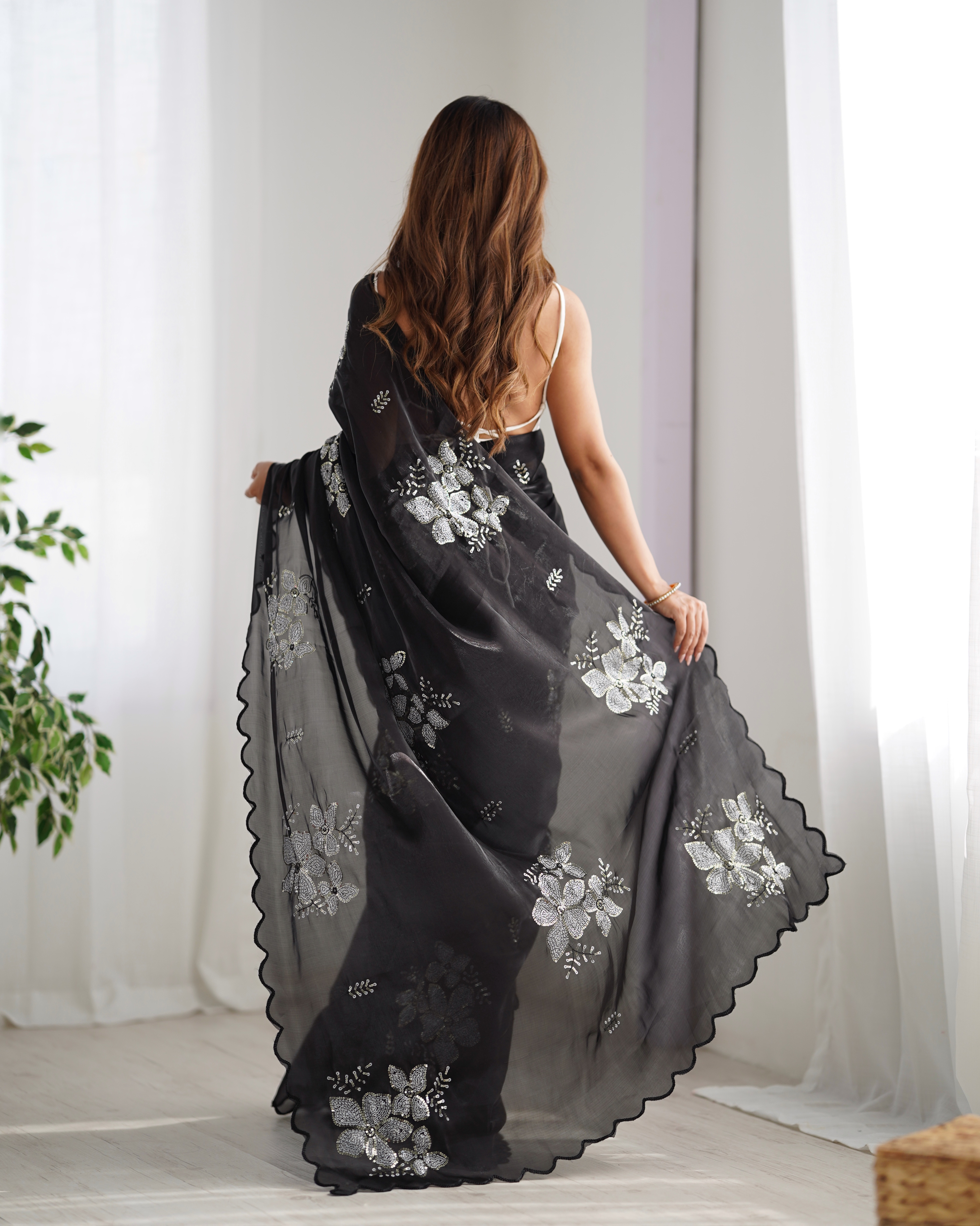 Drape yourself in luxury and sophistication with this exquisite black saree