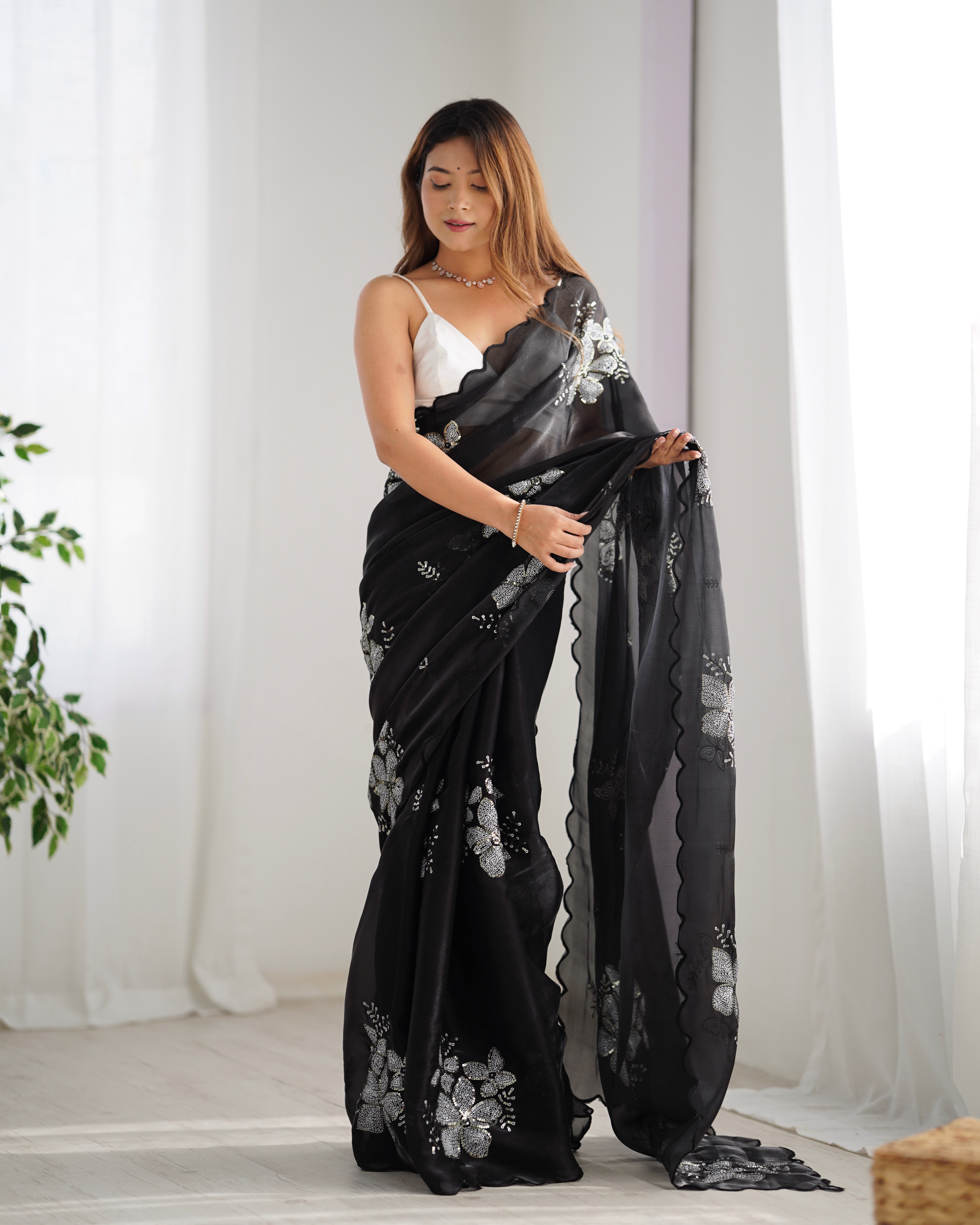 Drape yourself in luxury and sophistication with this exquisite black saree