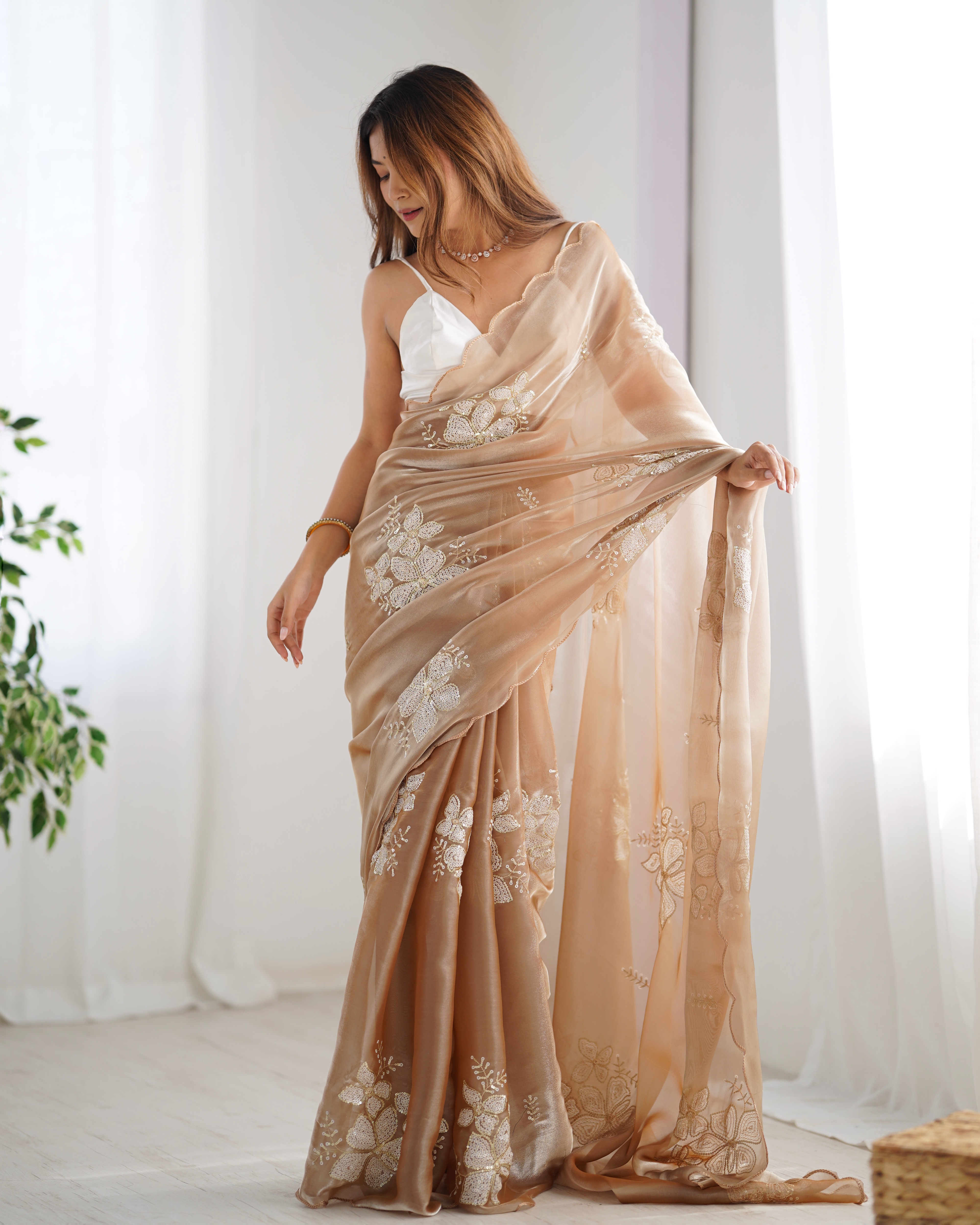 Embrace sophisticated charm with this stunning beige saree