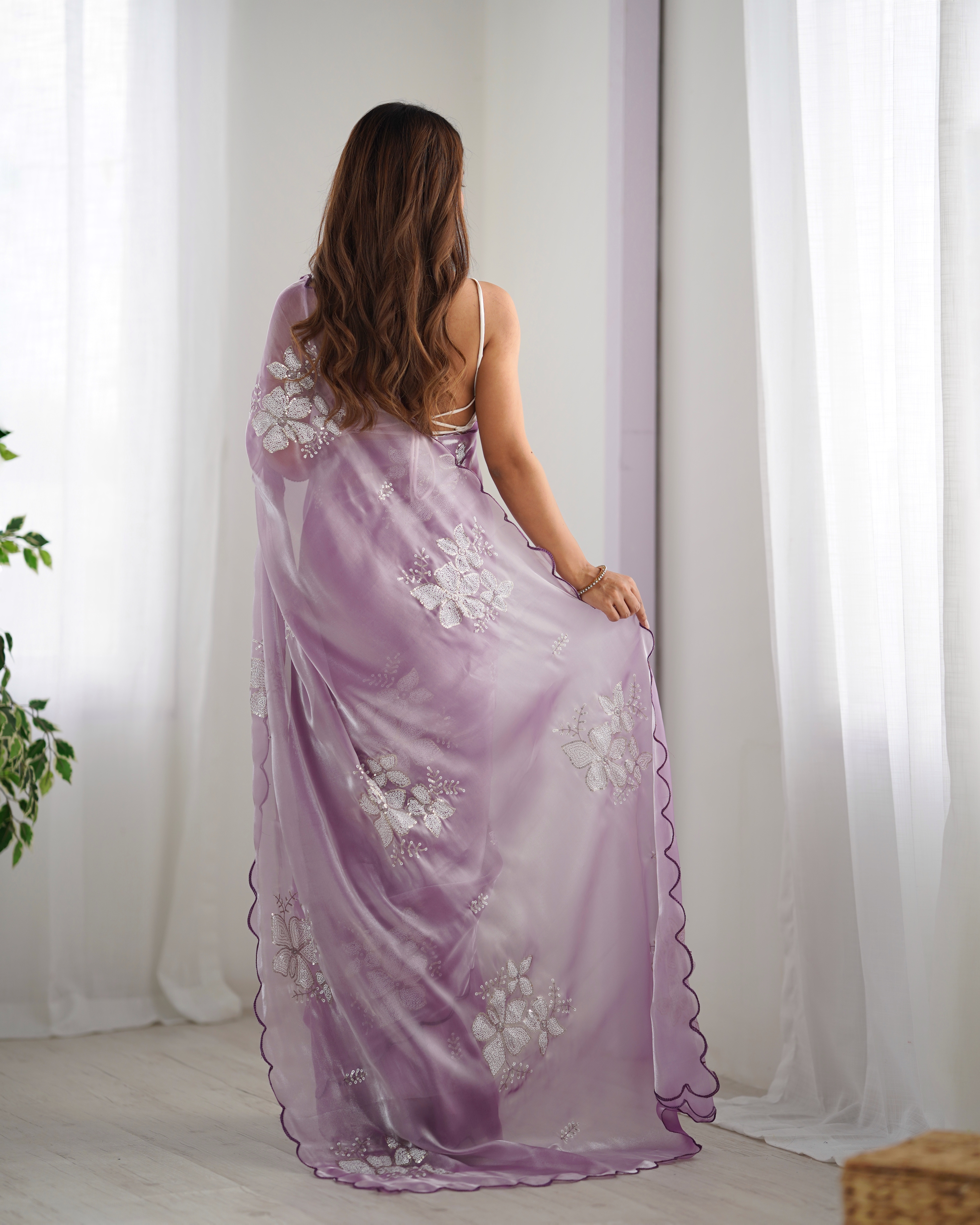 Step into refined elegance with this lavender saree