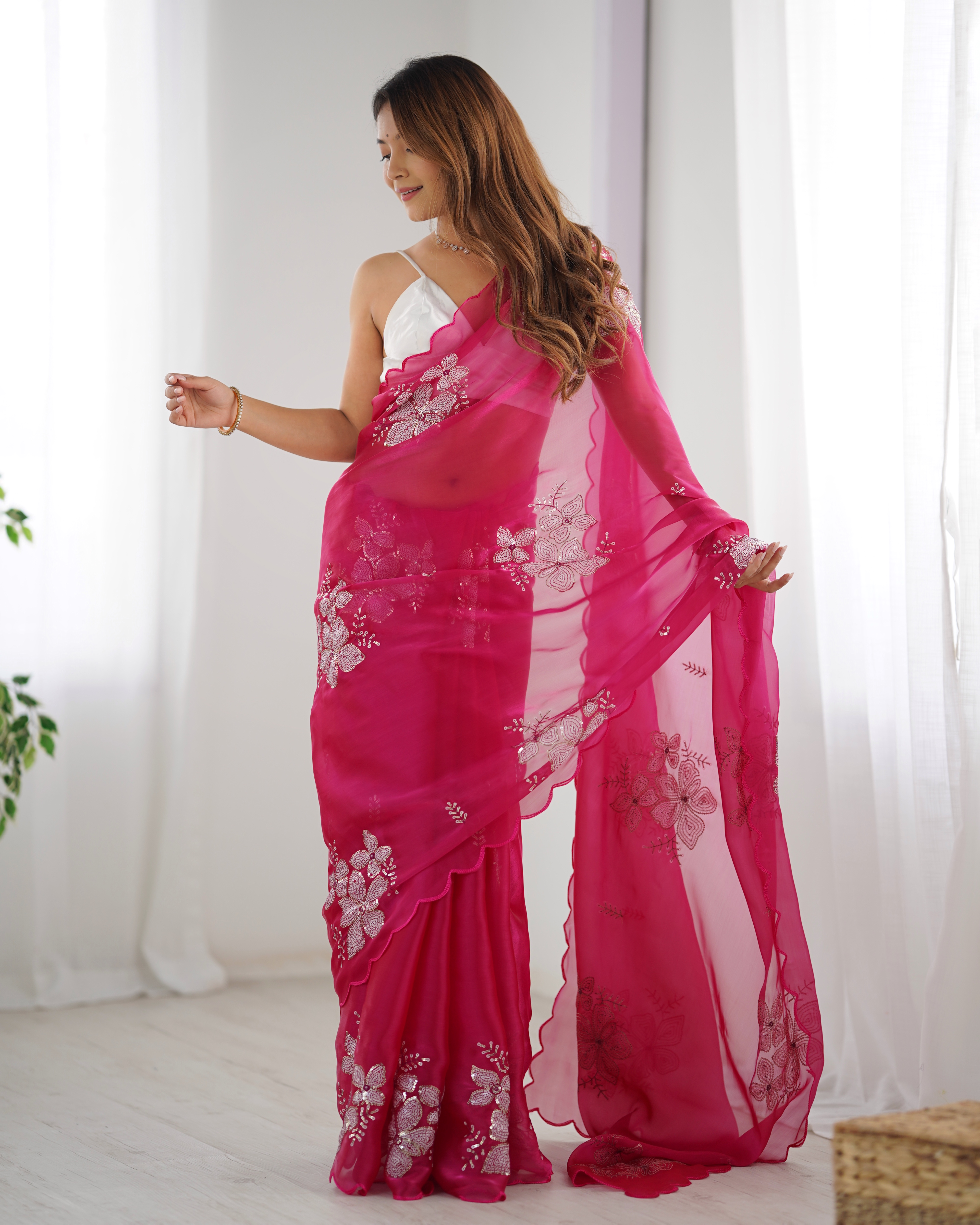 Drape yourself in the beauty of this exquisite pink saree