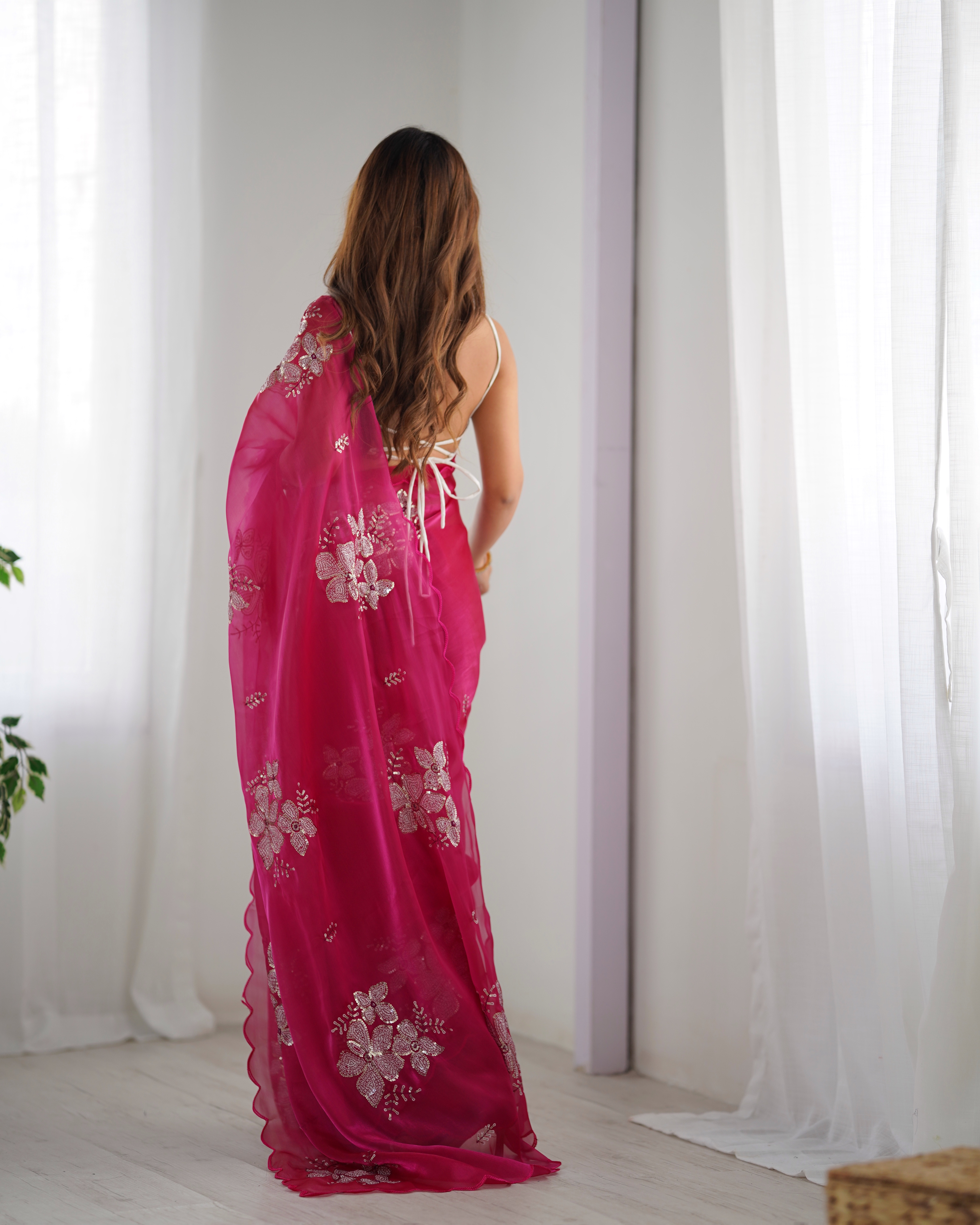 Drape yourself in the beauty of this exquisite pink saree