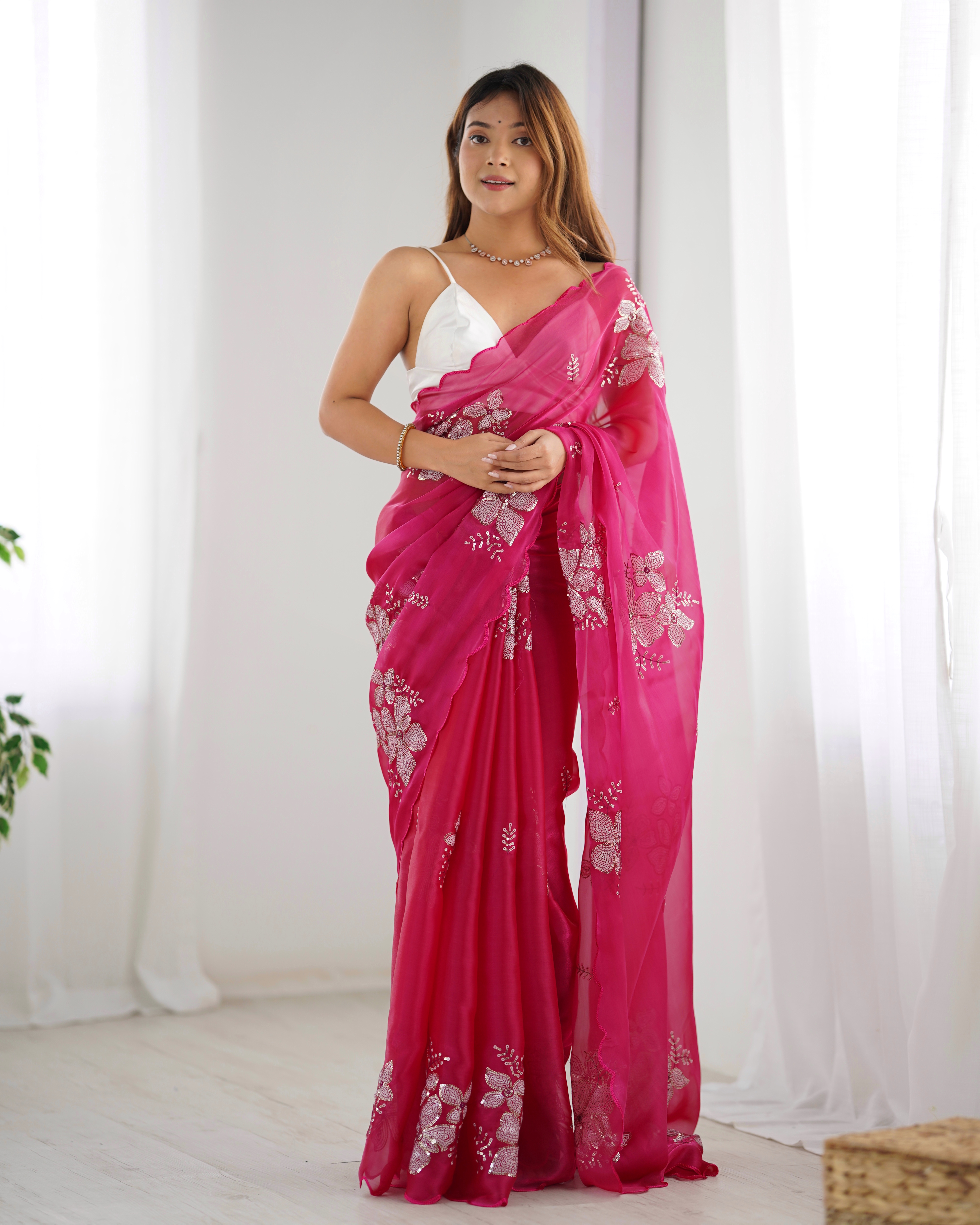 Drape yourself in the beauty of this exquisite pink saree