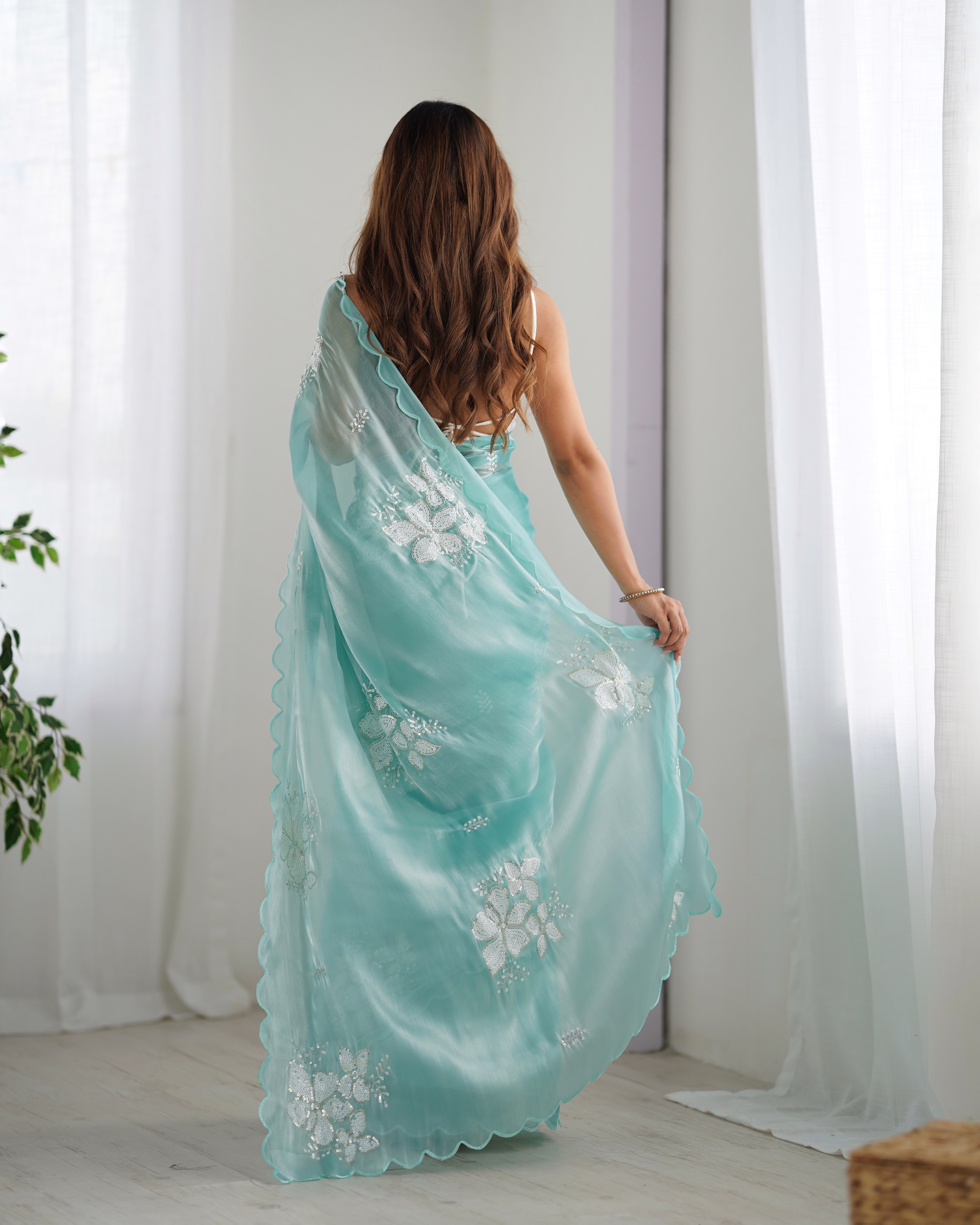 Step into effortless grace with this breathtaking sky blue party wear designer saree