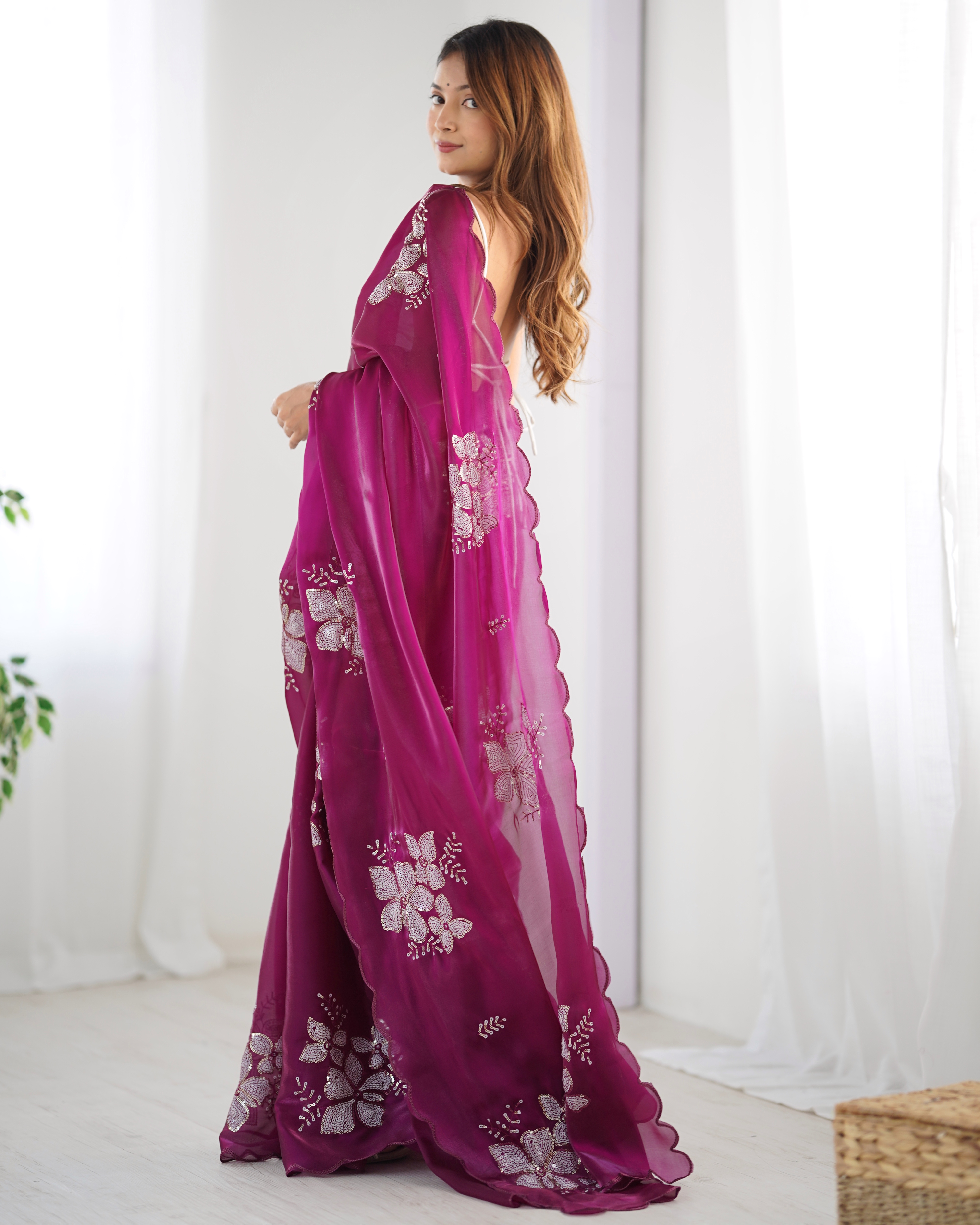 Indulge in luxury with this rich wine-colored designer saree