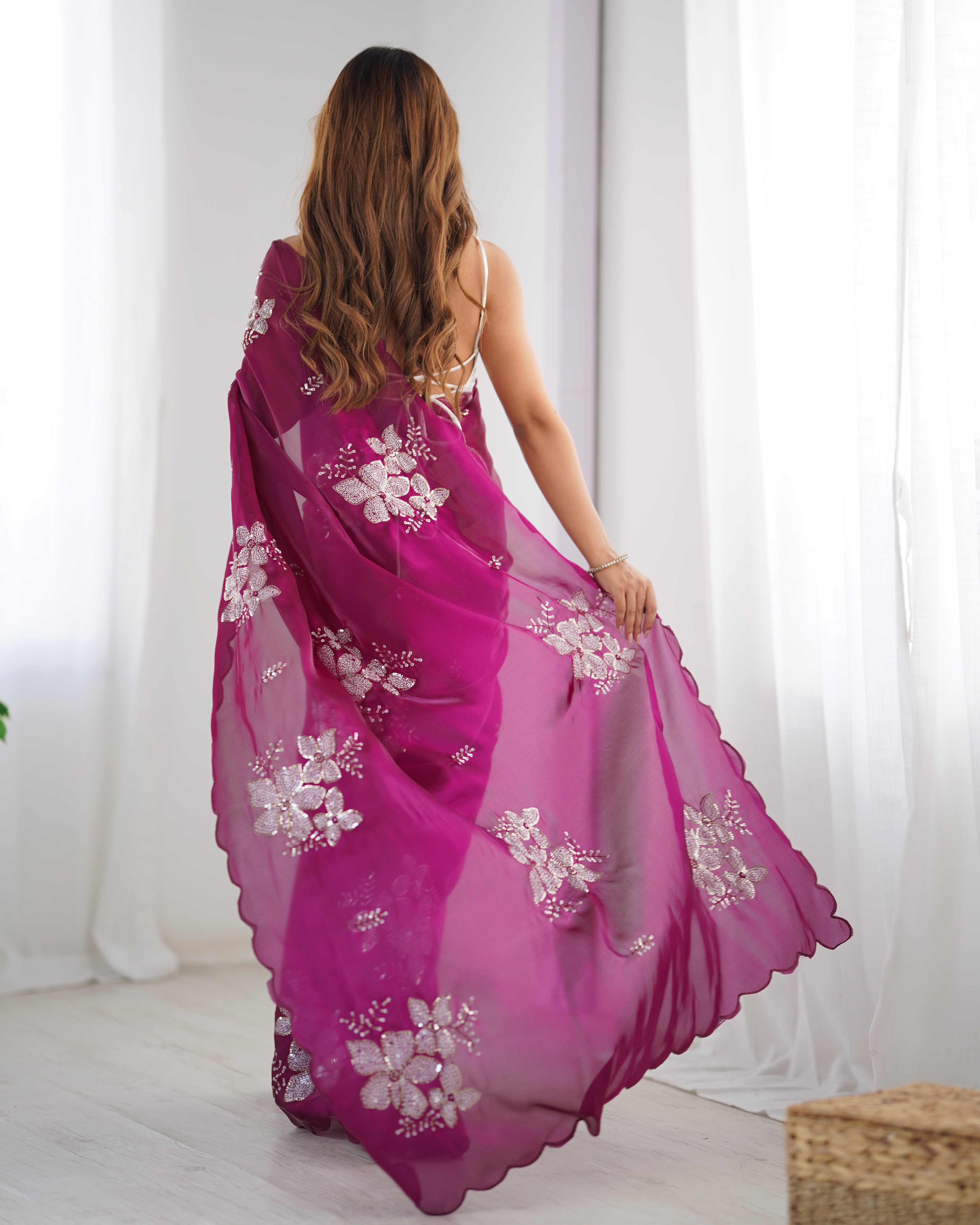 Indulge in luxury with this rich wine-colored designer saree