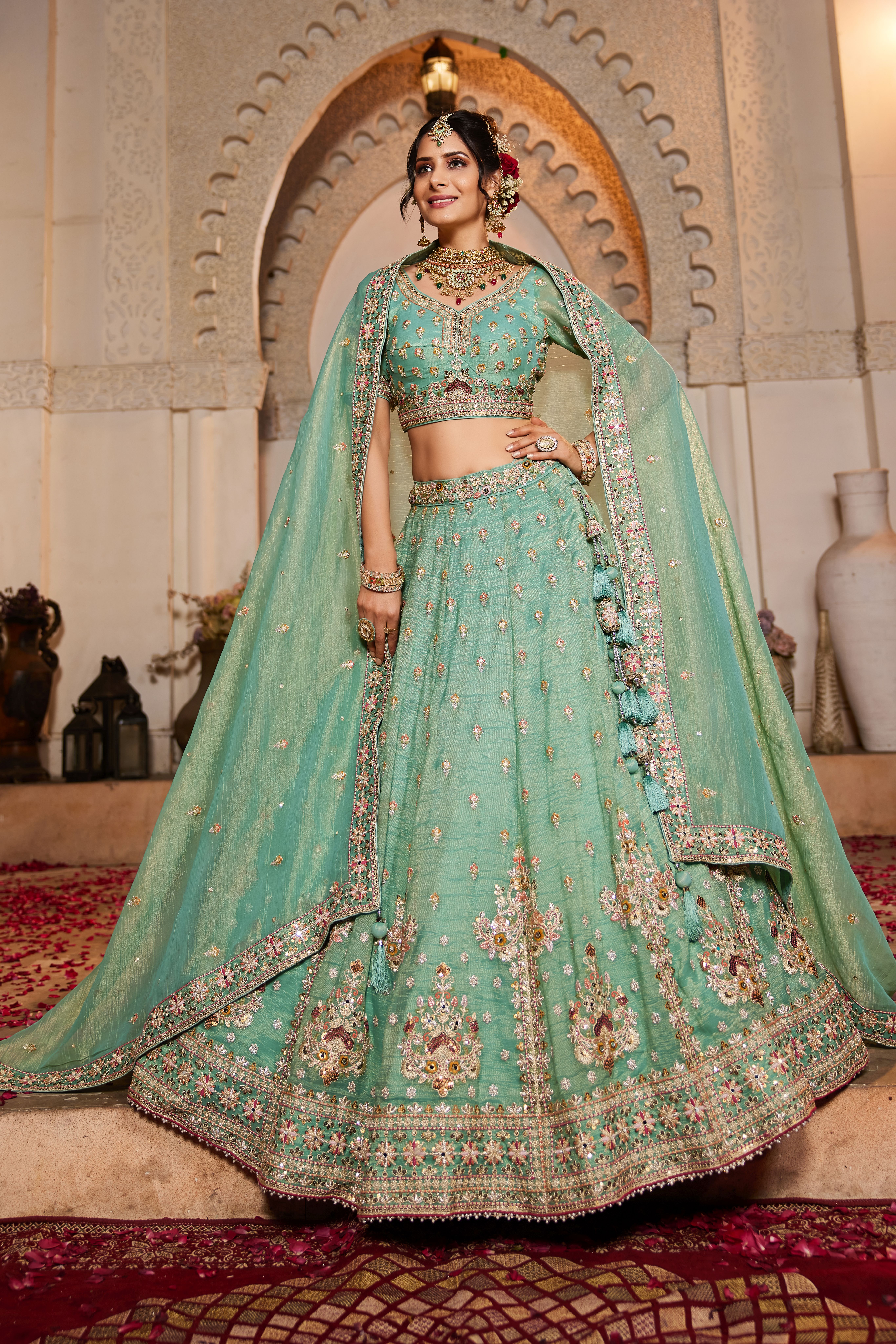 Make a statement at any wedding celebration with this Attractive Partywear Sea Green Designer Lehenga