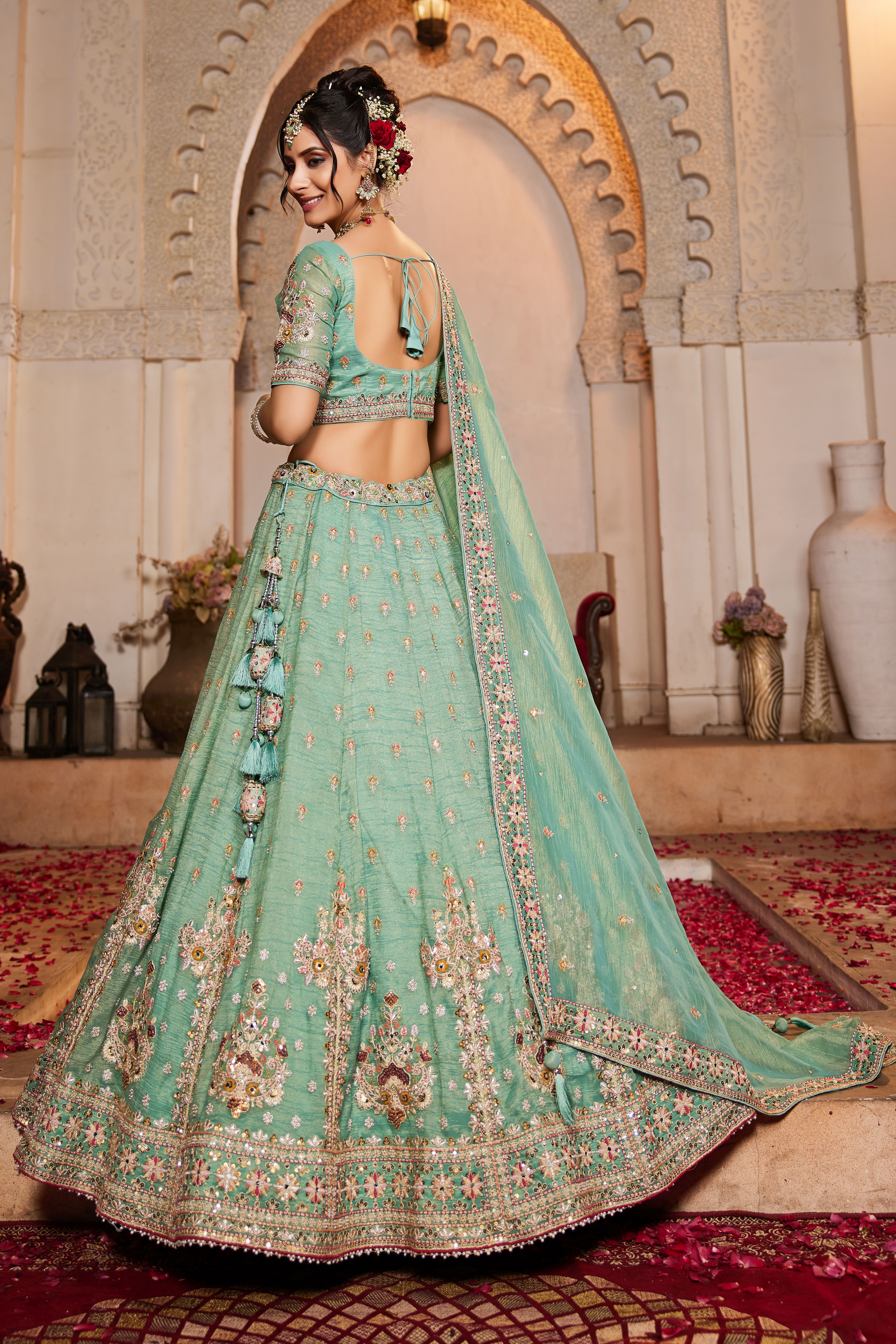 Make a statement at any wedding celebration with this Attractive Partywear Sea Green Designer Lehenga