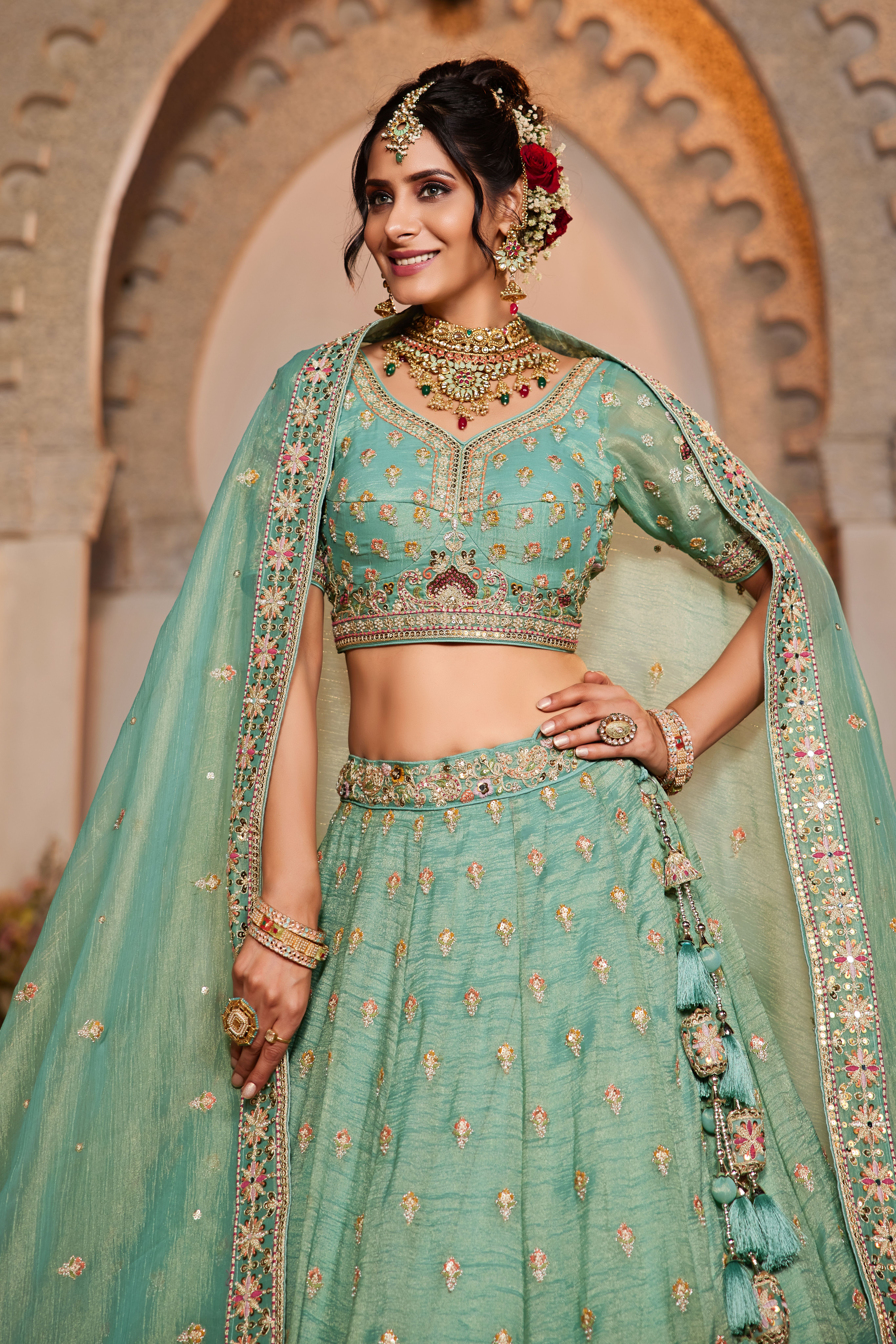 Make a statement at any wedding celebration with this Attractive Partywear Sea Green Designer Lehenga