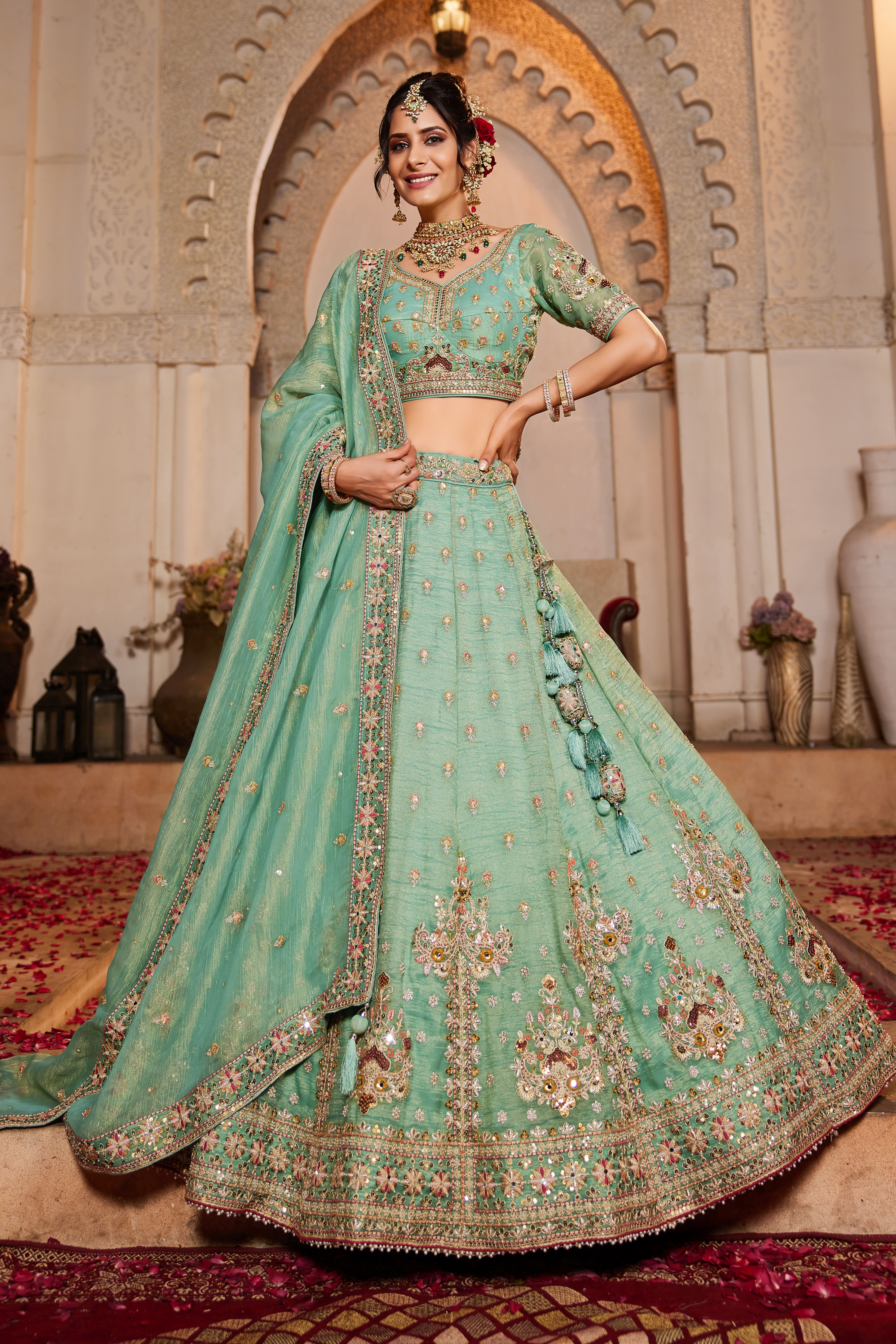 Make a statement at any wedding celebration with this Attractive Partywear Sea Green Designer Lehenga