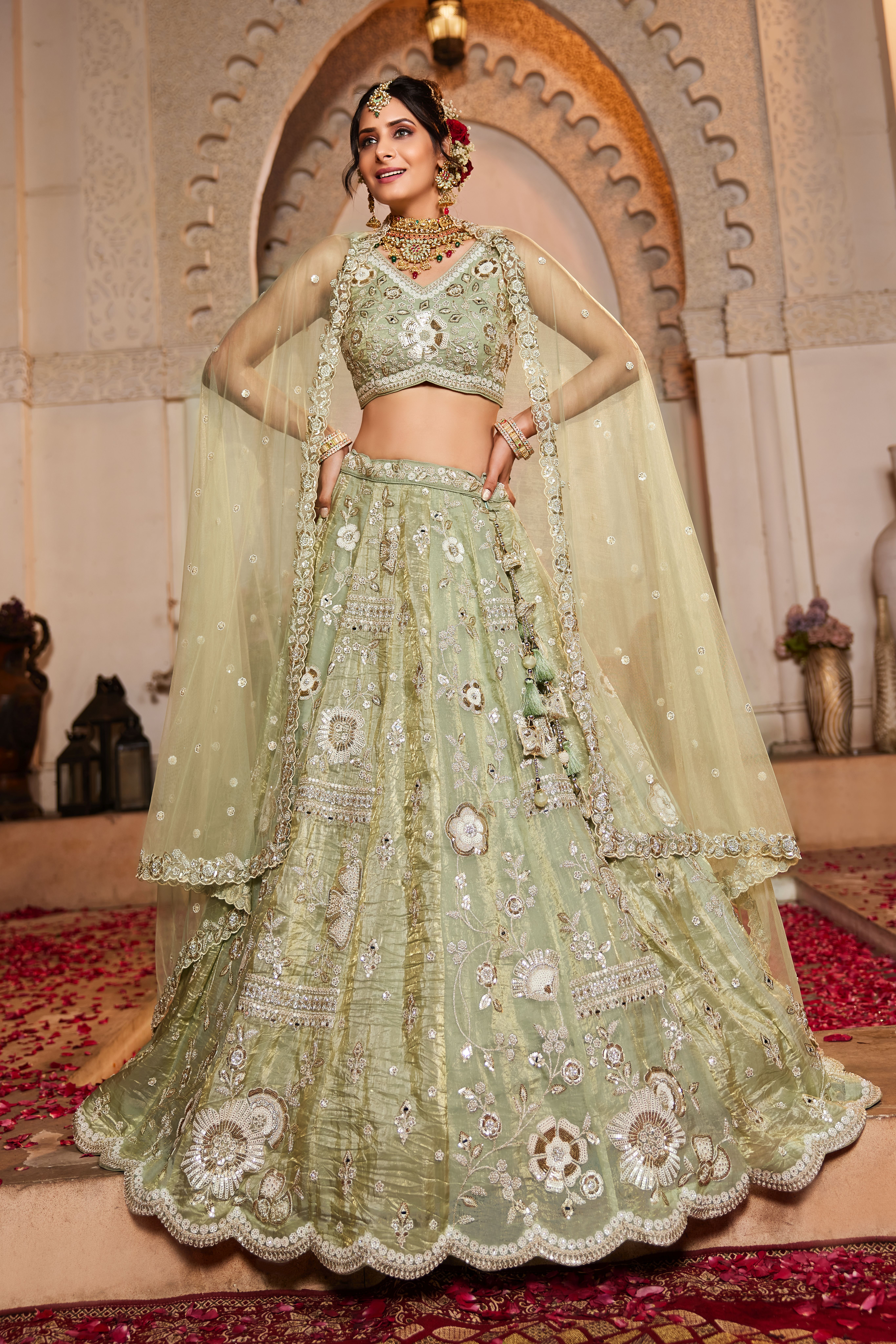Enhance your wedding look with this Attractive Partywear Pistachio Green Designer Lehenga and Choli