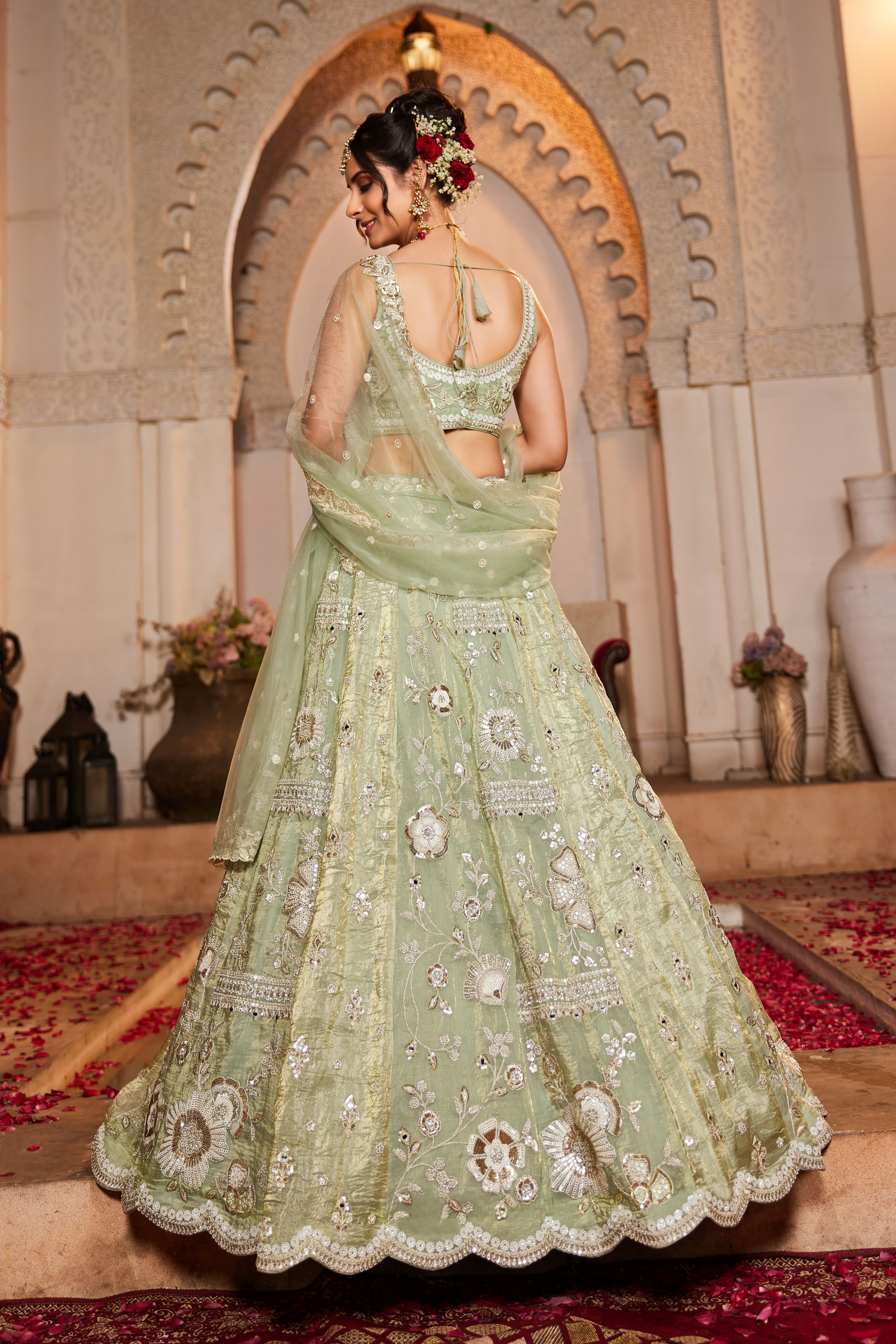 Enhance your wedding look with this Attractive Partywear Pistachio Green Designer Lehenga and Choli