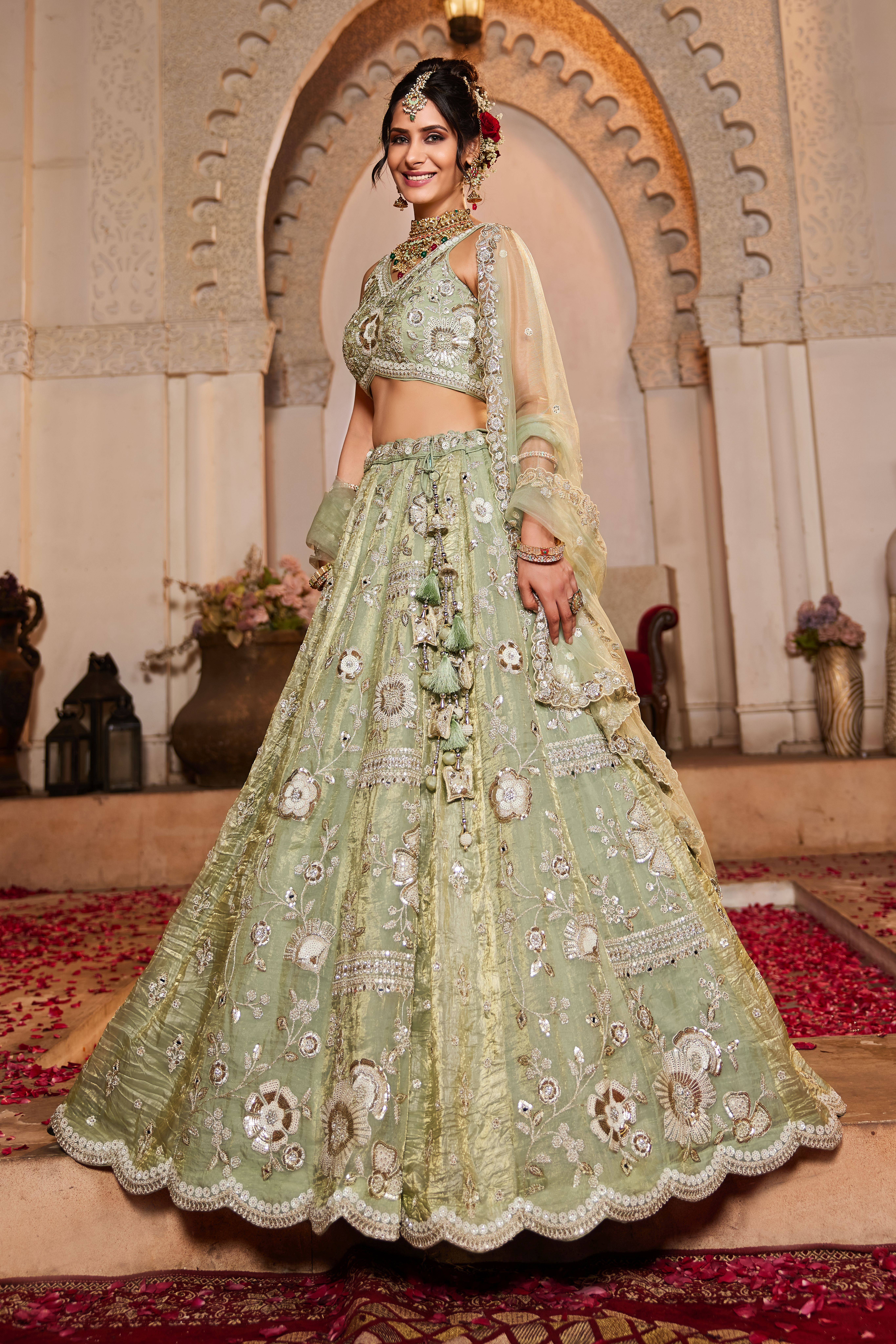 Enhance your wedding look with this Attractive Partywear Pistachio Green Designer Lehenga and Choli