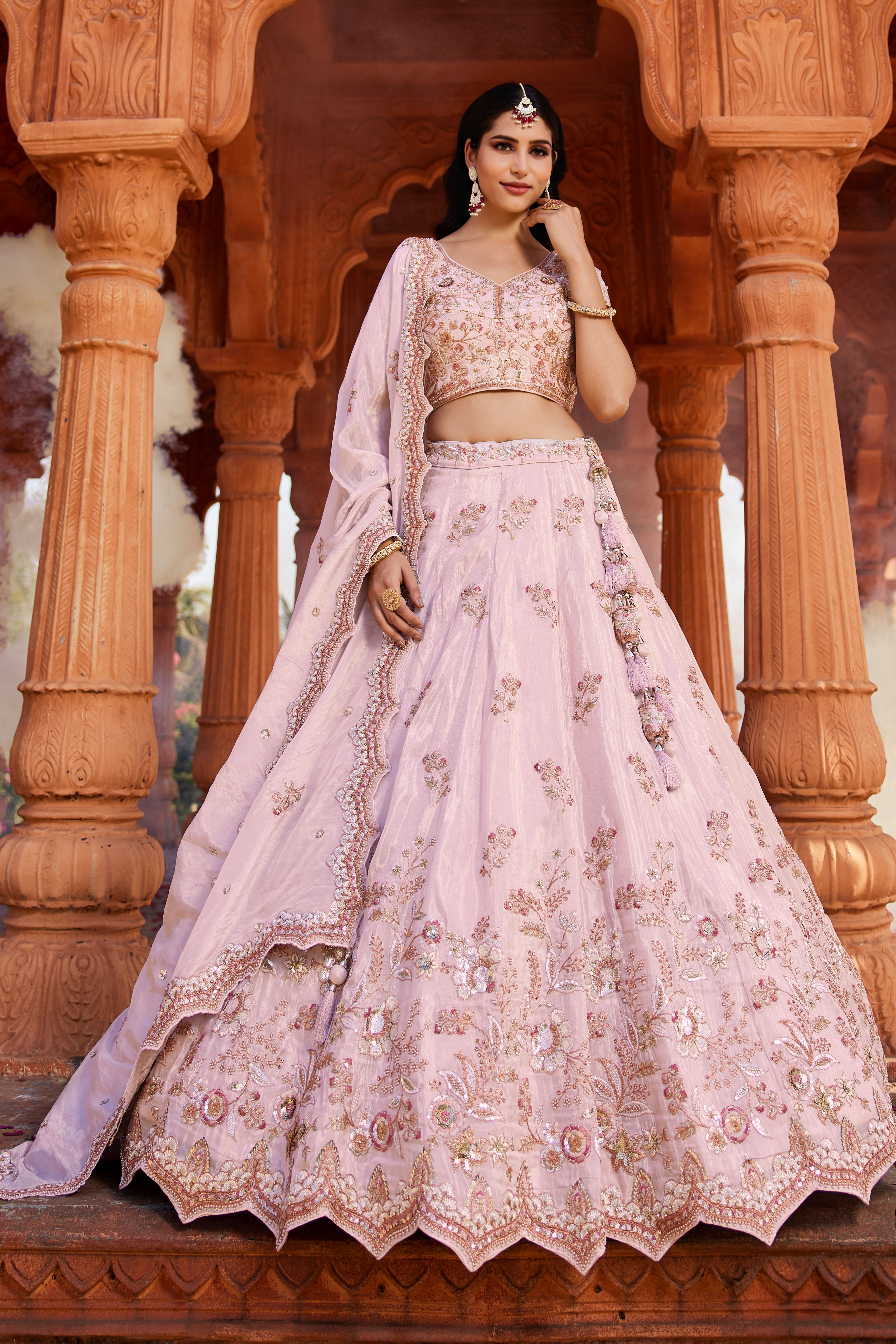 Make a captivating entrance with this stunning Coral Designer Lehenga