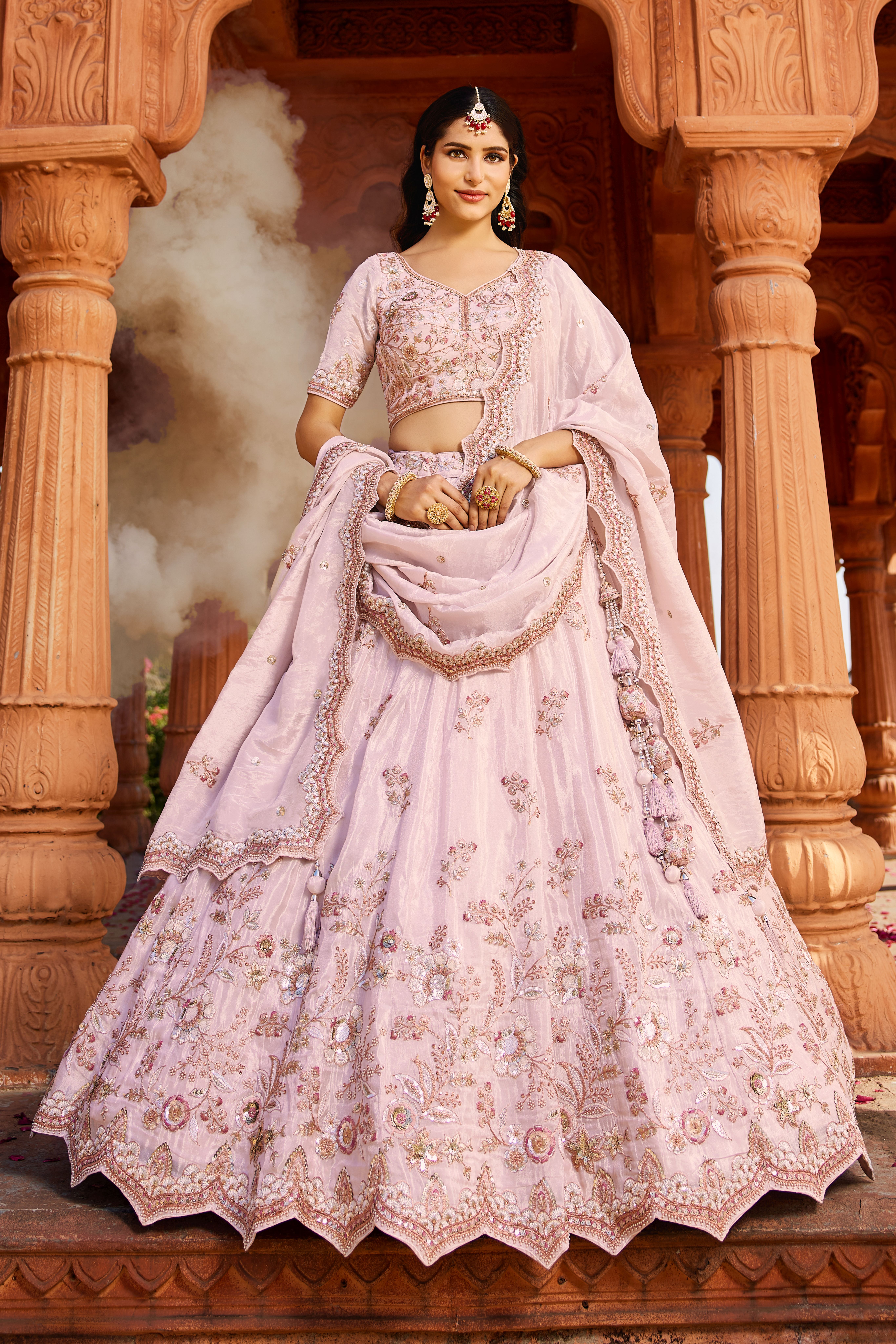 Make a captivating entrance with this stunning Coral Designer Lehenga
