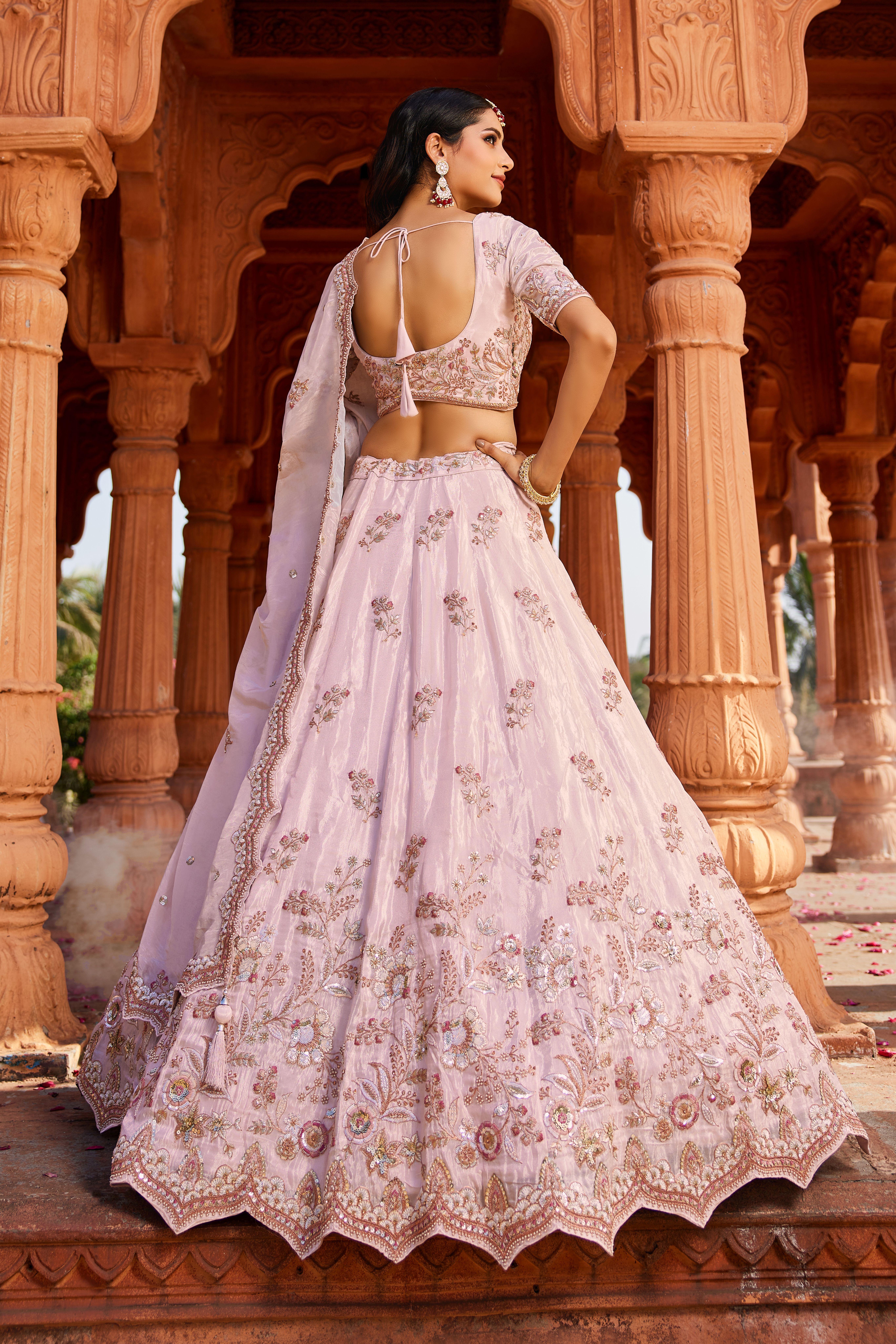 Make a captivating entrance with this stunning Coral Designer Lehenga