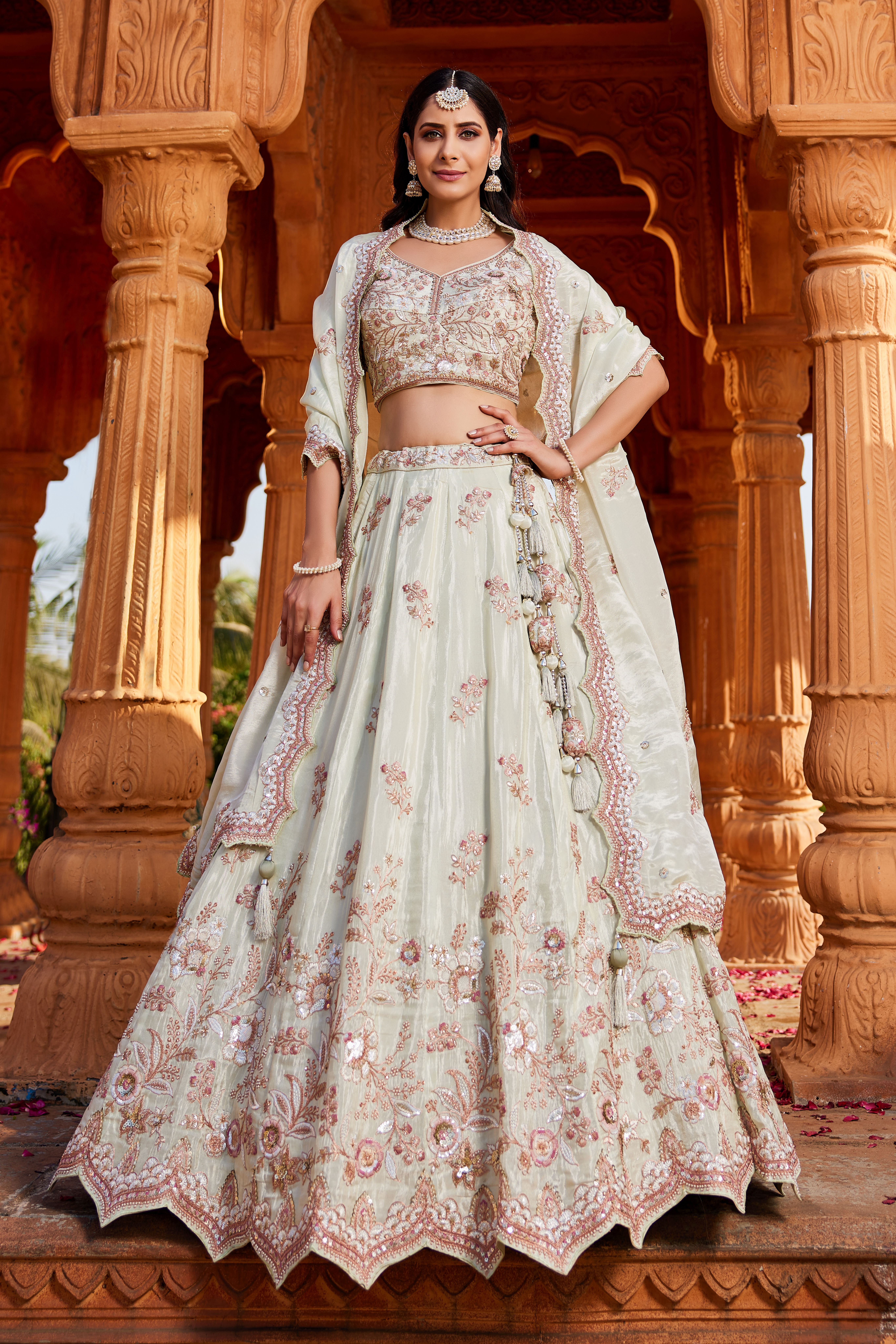 Step into elegance with this graceful Pista Green Designer Lehenga