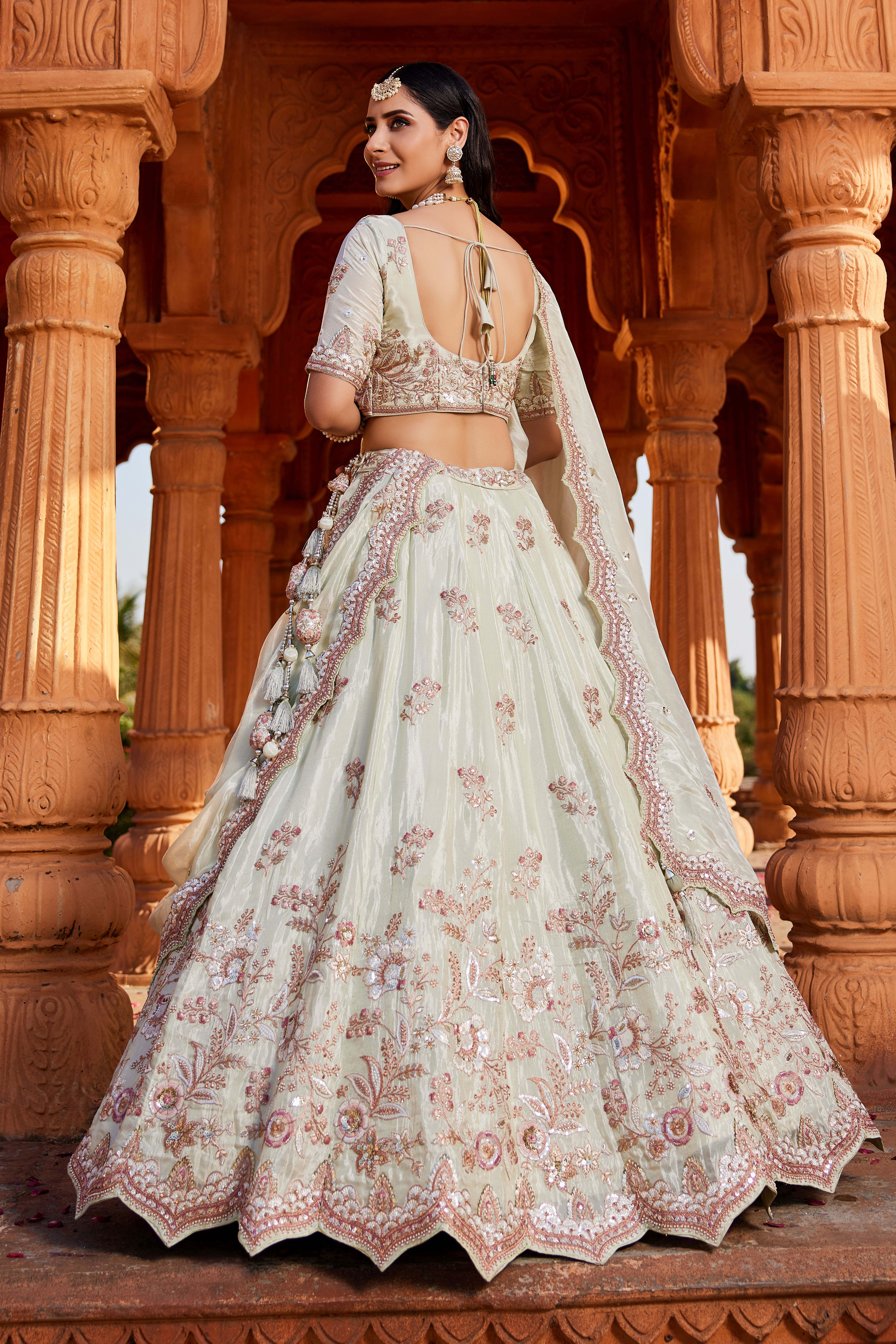 Step into elegance with this graceful Pista Green Designer Lehenga